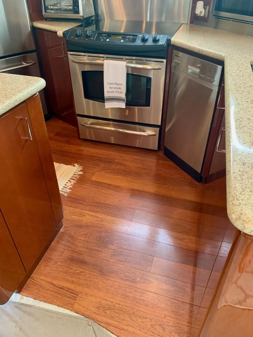 a kitchen with a stainless steel oven aboard QUEEN MARA Yacht for Sale