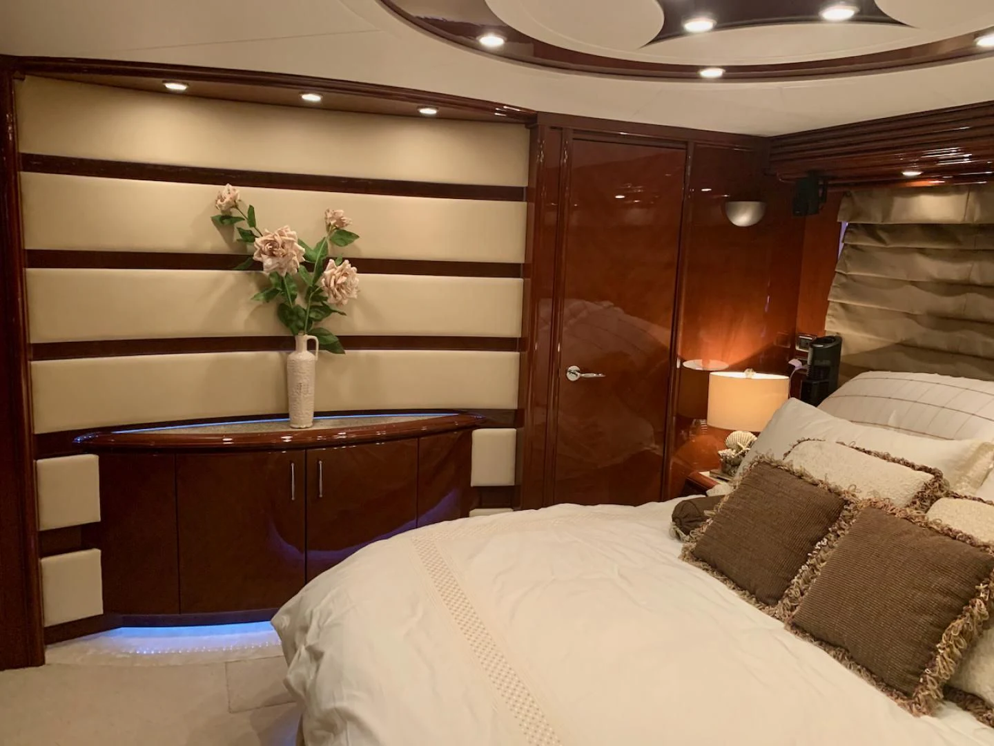a bedroom with a bed and a desk aboard QUEEN MARA Yacht for Sale