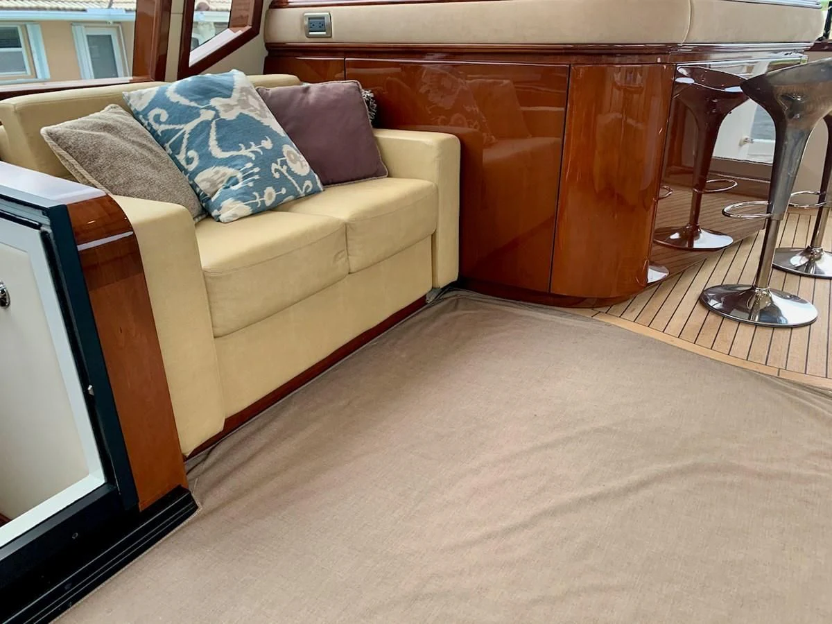 a couch with a pillow on it aboard QUEEN MARA Yacht for Sale