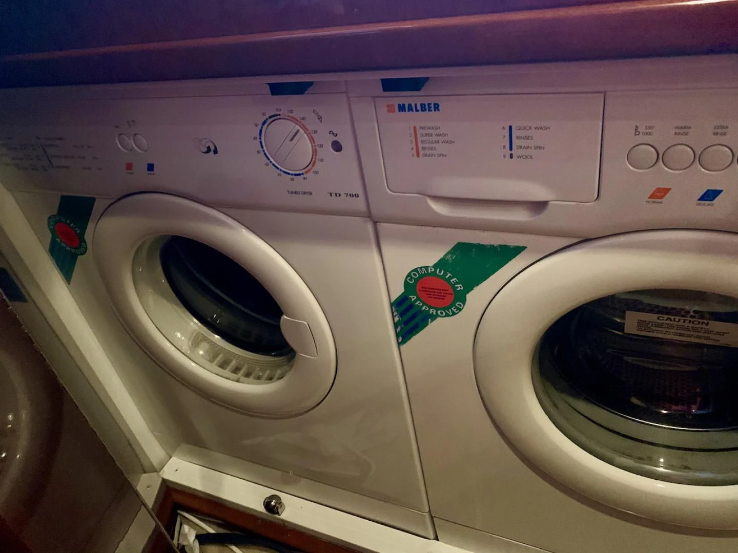 a white washing machine aboard QUEEN MARA Yacht for Sale