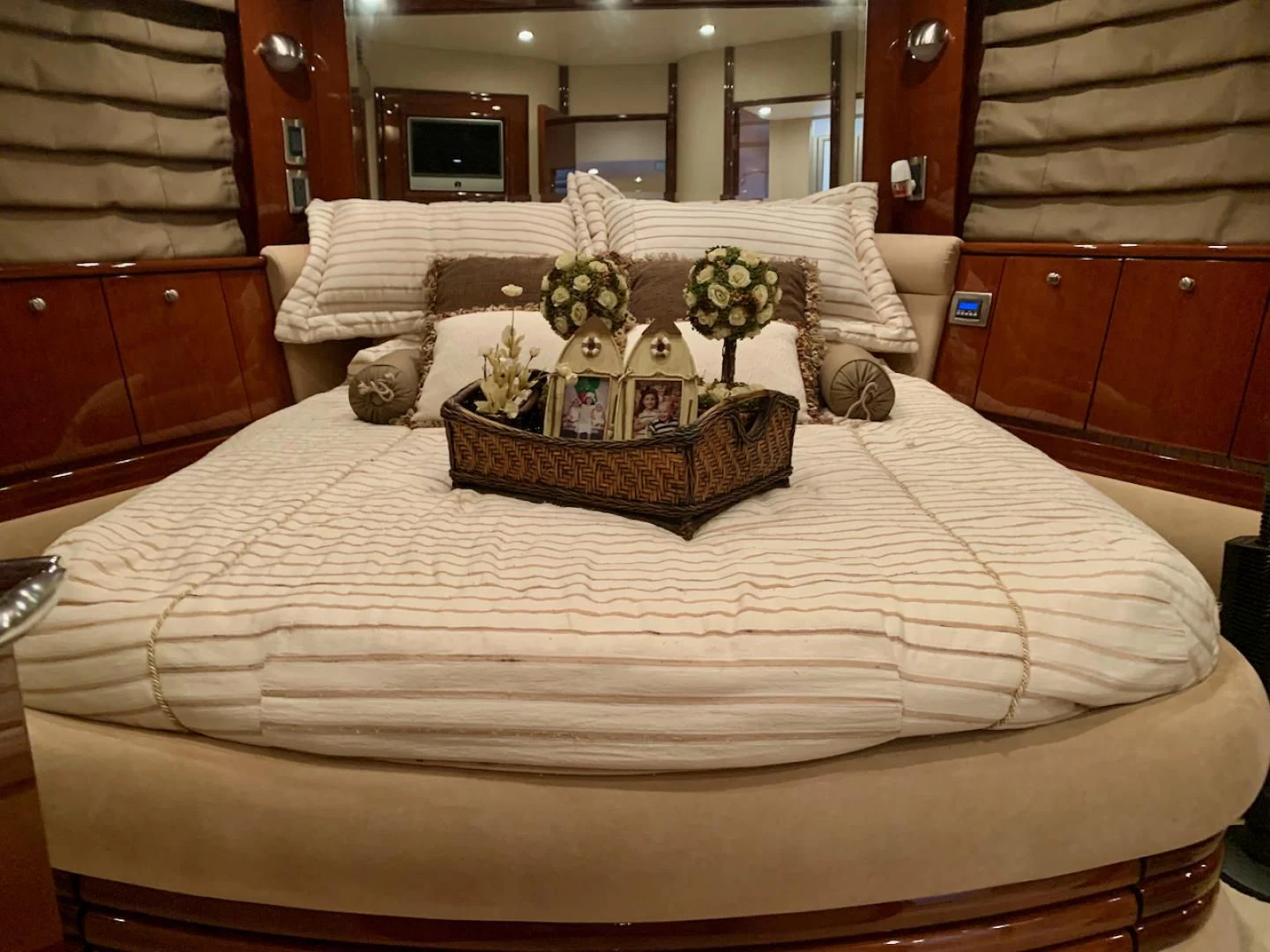 a bed with a basket on it aboard QUEEN MARA Yacht for Sale