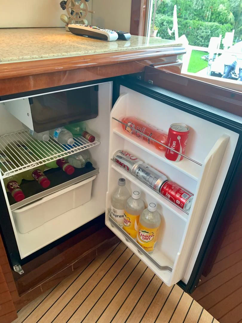 a refrigerator with a door open aboard QUEEN MARA Yacht for Sale