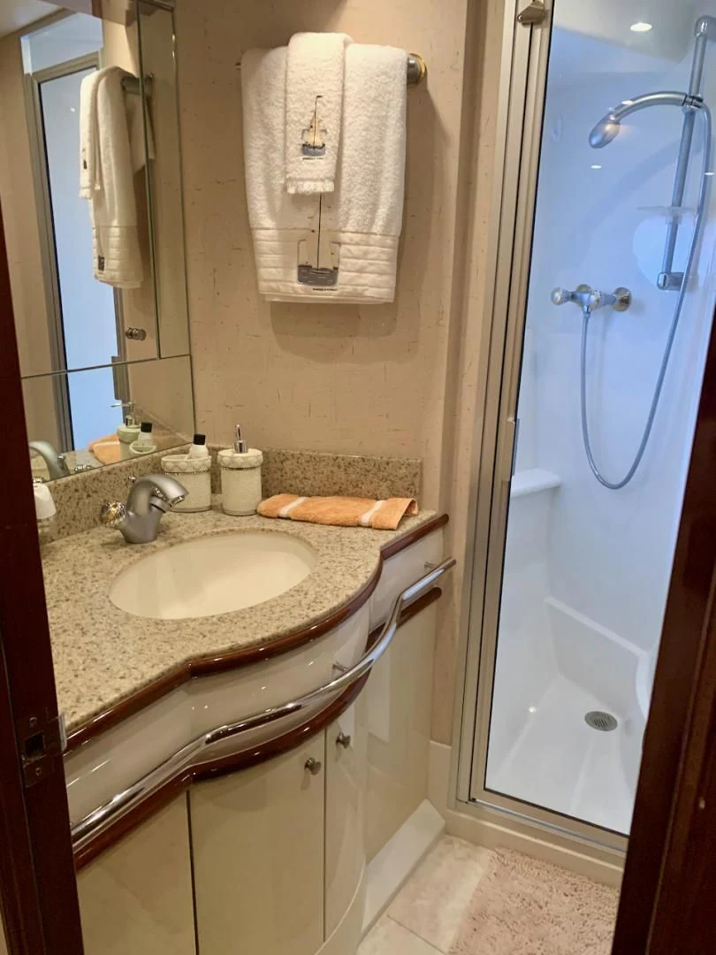 a bathroom with a sink and a mirror aboard QUEEN MARA Yacht for Sale