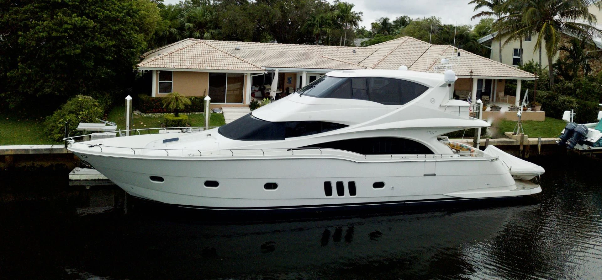 a white boat on the water aboard QUEEN MARA Yacht for Sale