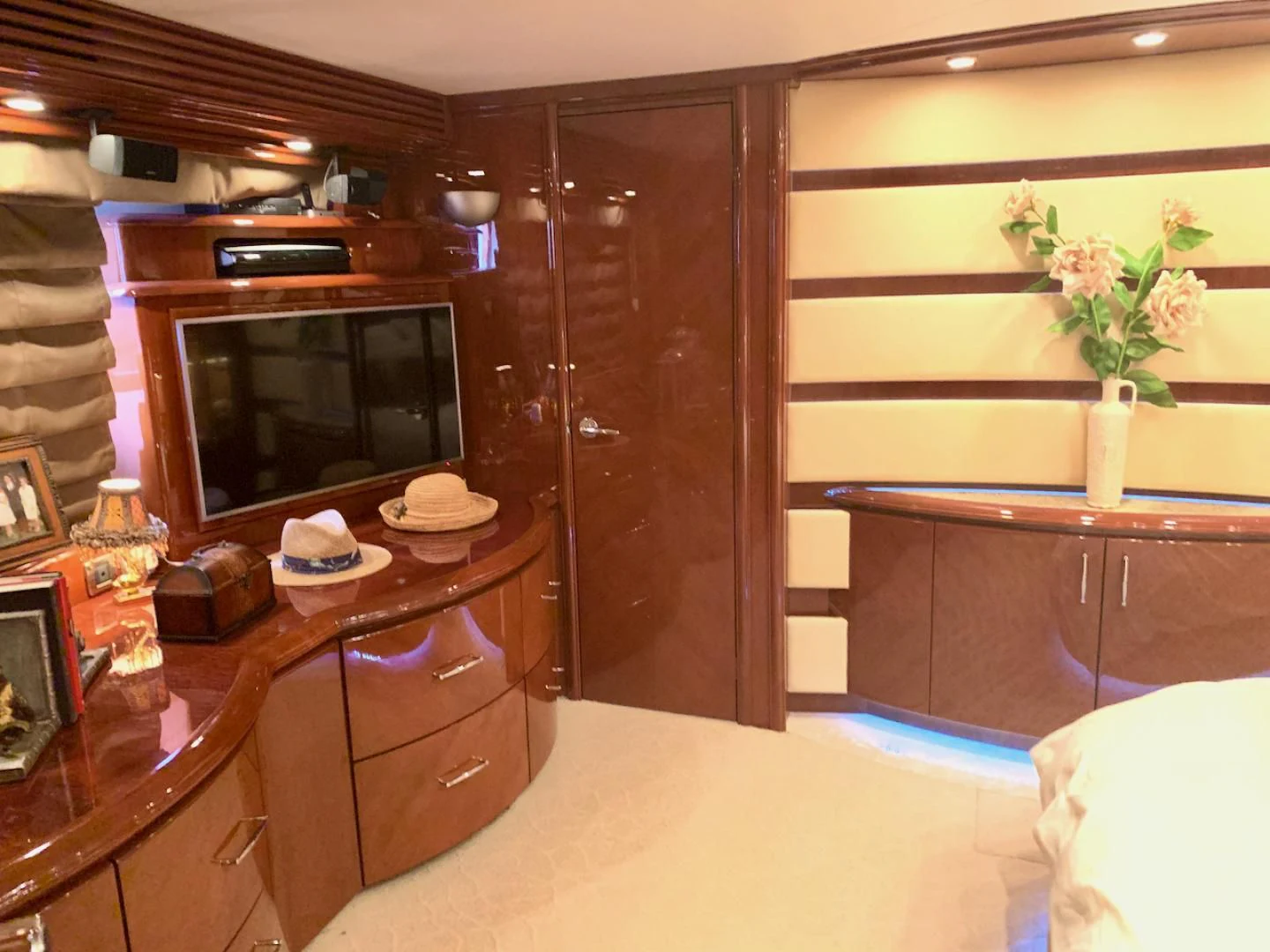 a room with a tv and a dresser aboard QUEEN MARA Yacht for Sale