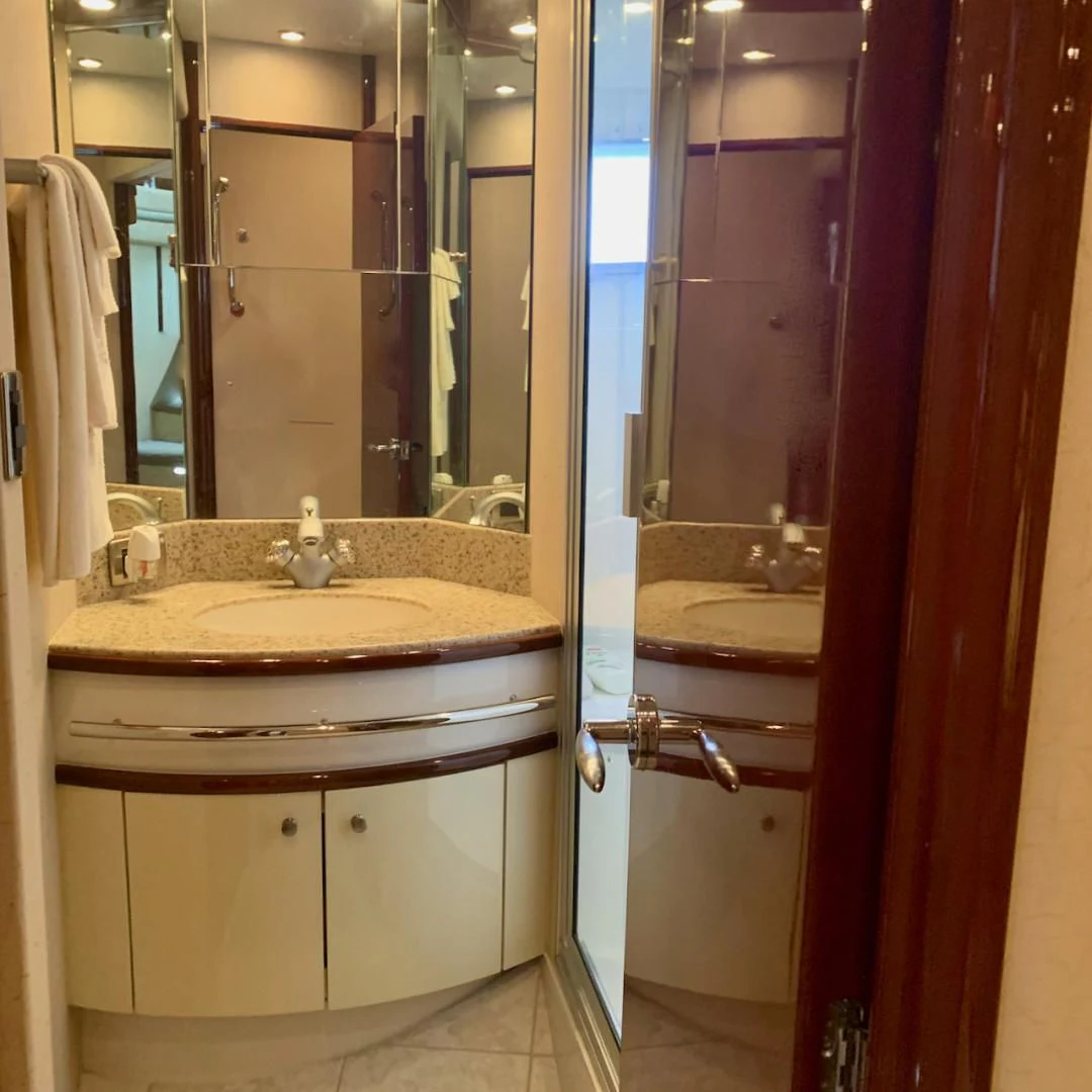 a bathroom with a sink and a mirror aboard QUEEN MARA Yacht for Sale