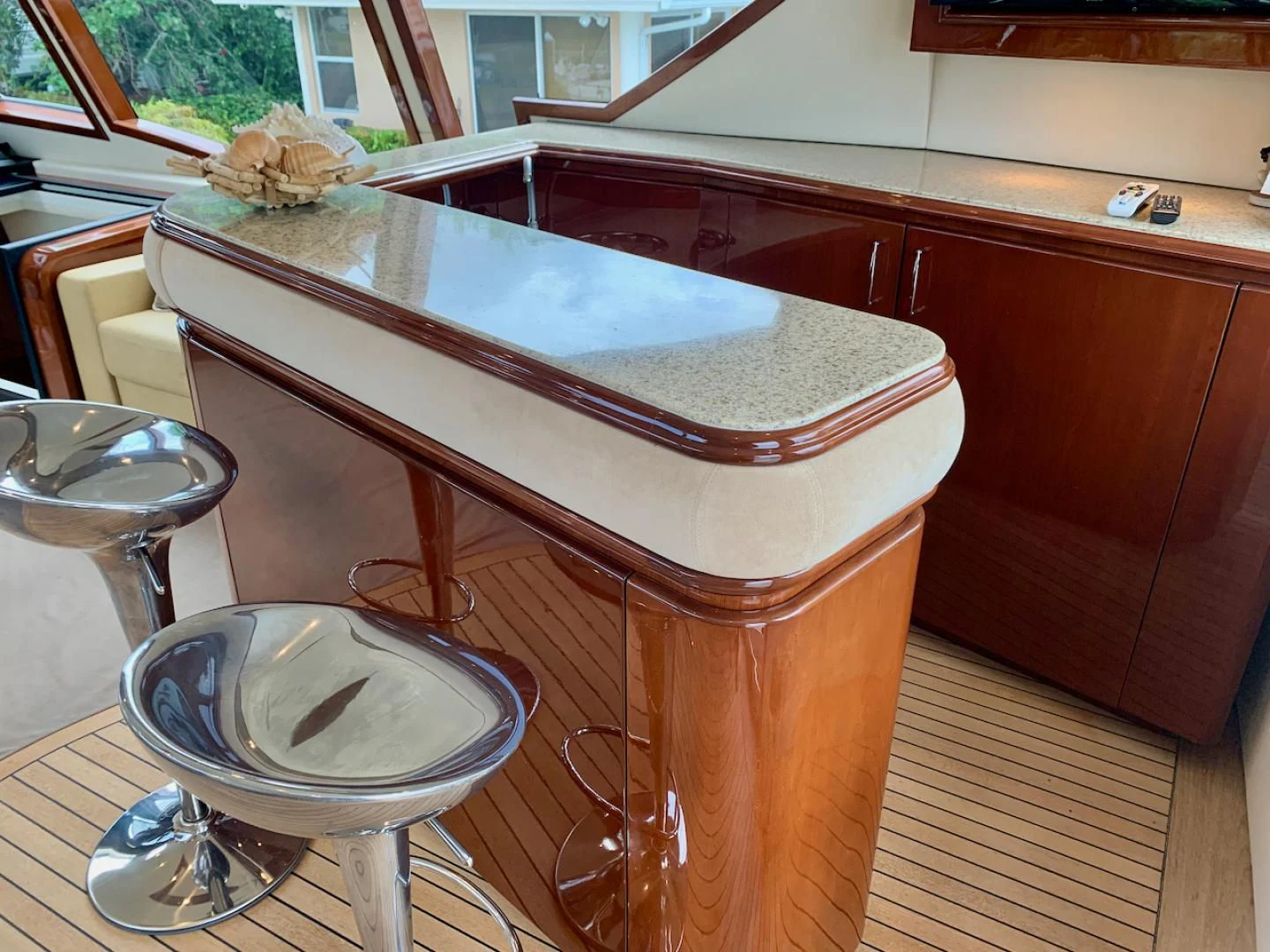 a kitchen island with a stool aboard QUEEN MARA Yacht for Sale