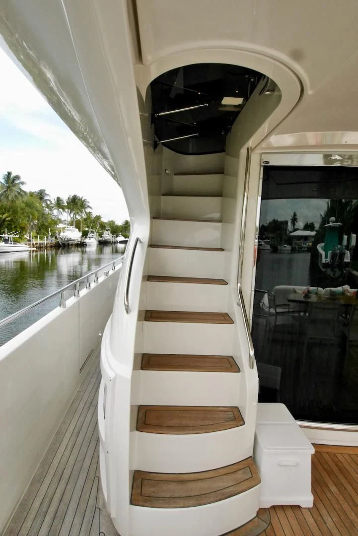 a staircase with a glass door aboard QUEEN MARA Yacht for Sale