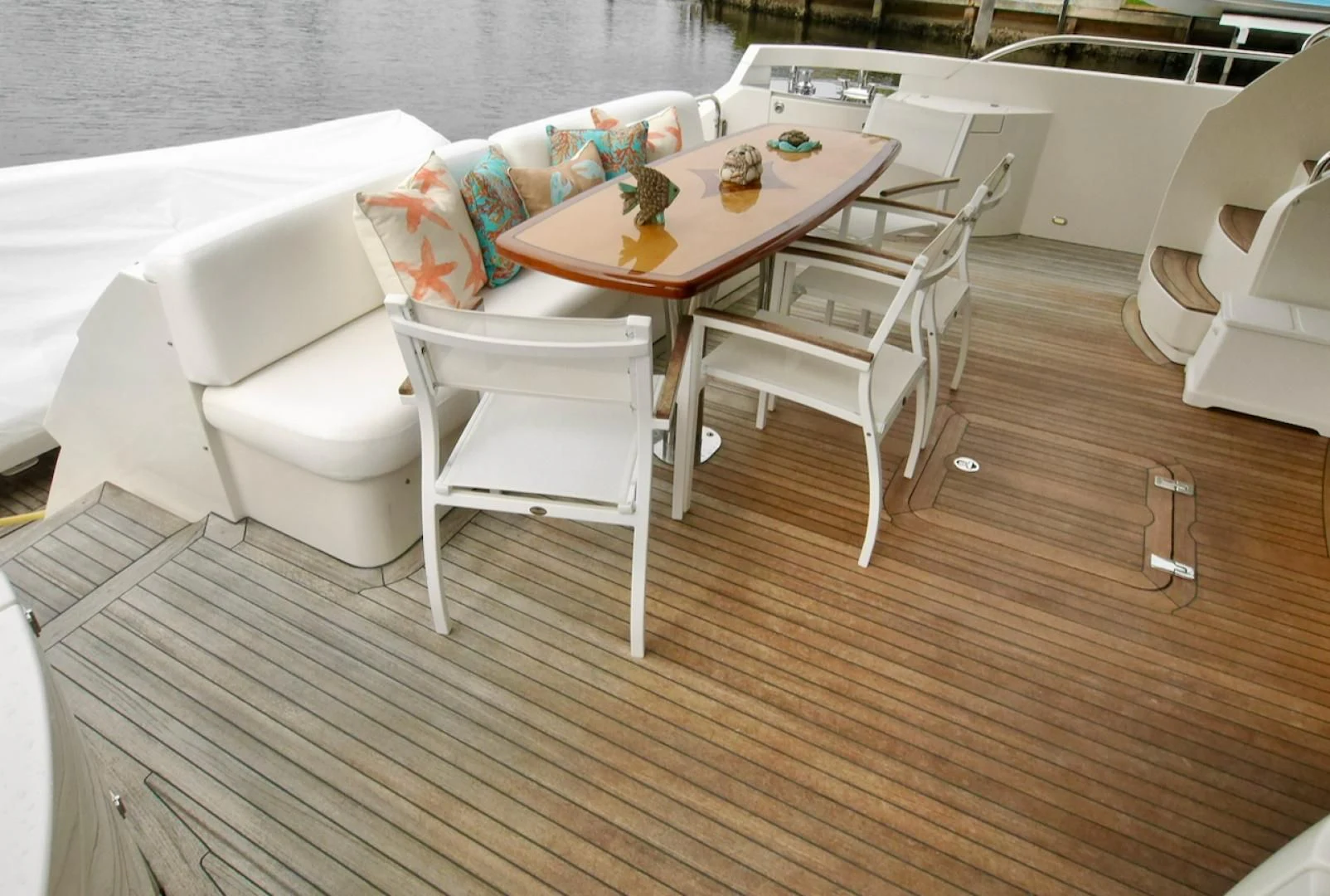 a table and chairs in a room aboard QUEEN MARA Yacht for Sale