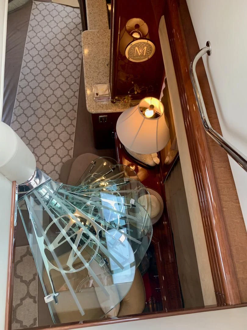 a shopping cart with a basket and a lamp aboard QUEEN MARA Yacht for Sale