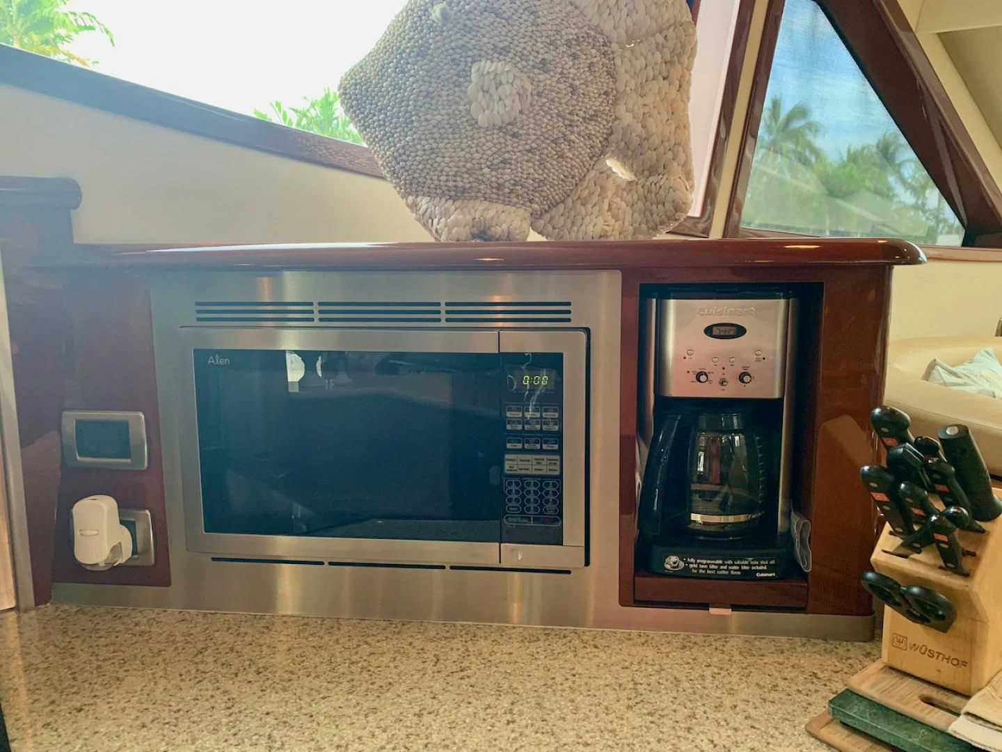 a microwave oven with a towel on top aboard QUEEN MARA Yacht for Sale