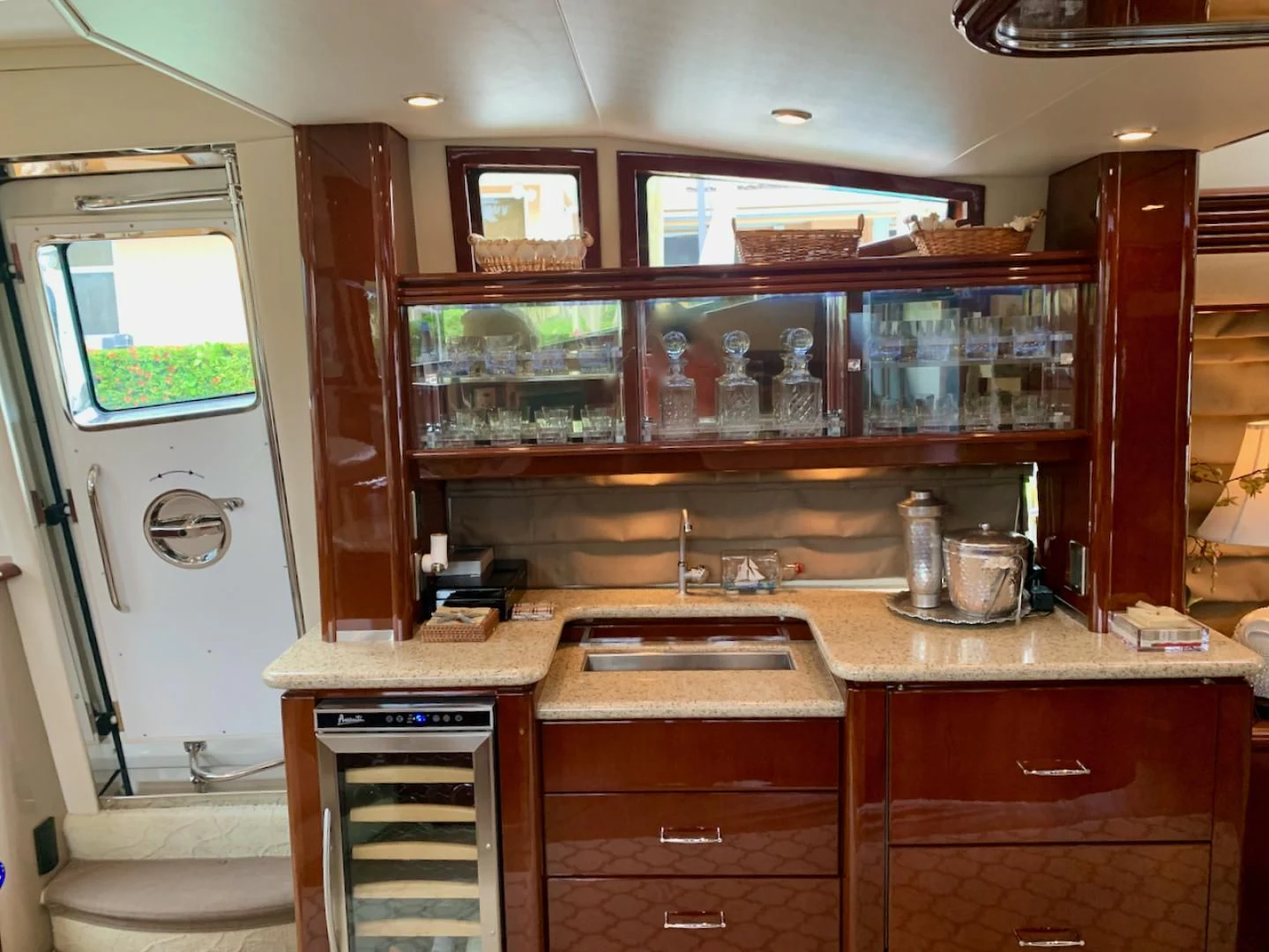 a kitchen with a glass display case aboard QUEEN MARA Yacht for Sale