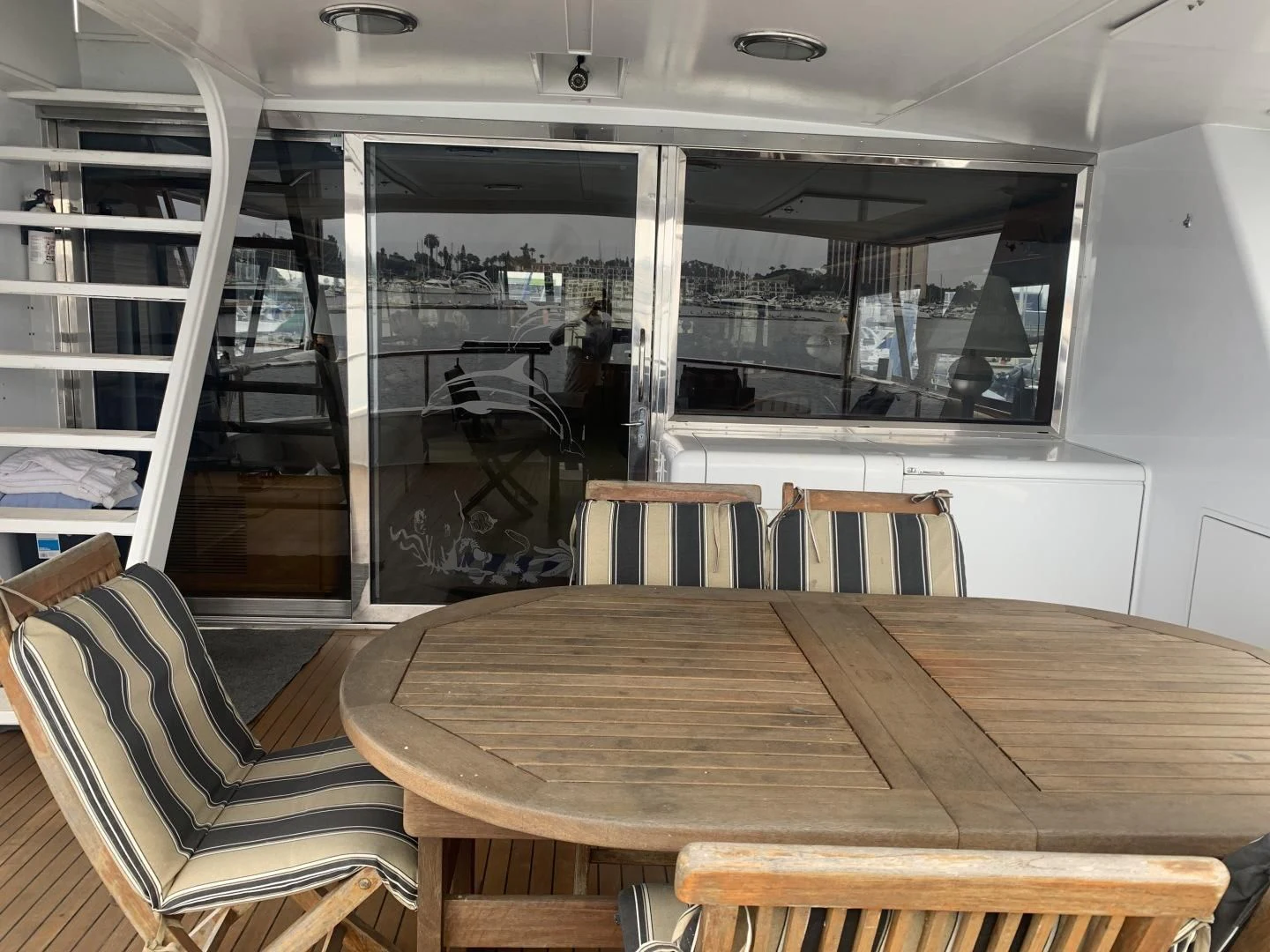 a table and chairs in a room aboard REHAB Yacht for Sale
