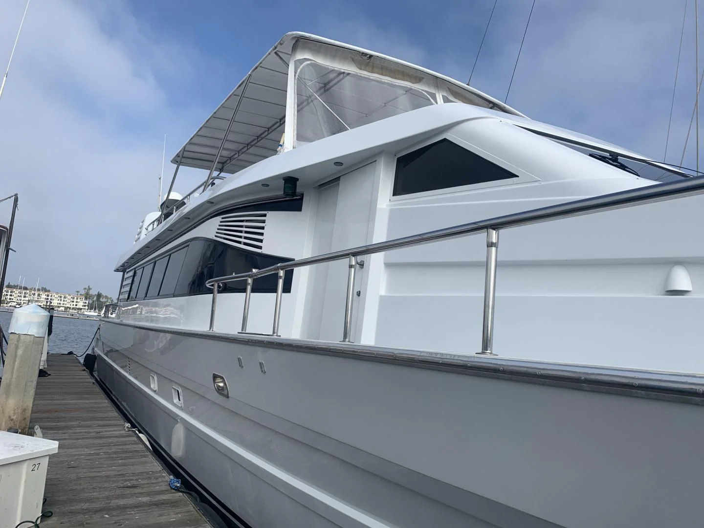 a white yacht docked aboard REHAB Yacht for Sale