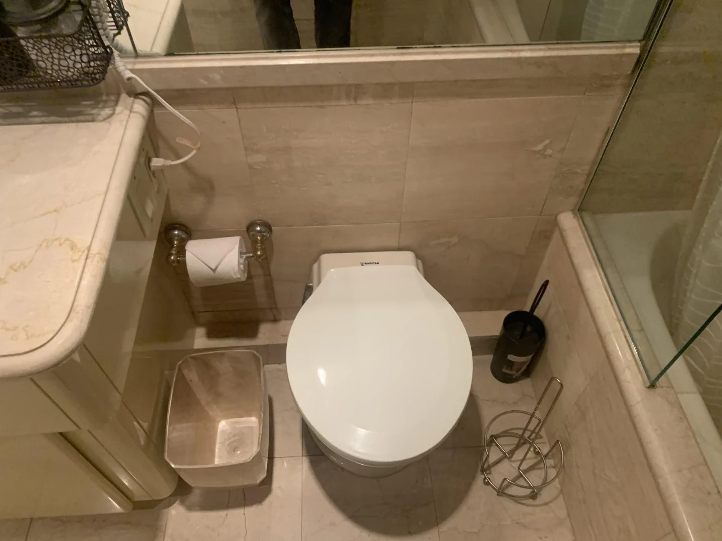 a toilet sits in a bathroom aboard REHAB Yacht for Sale