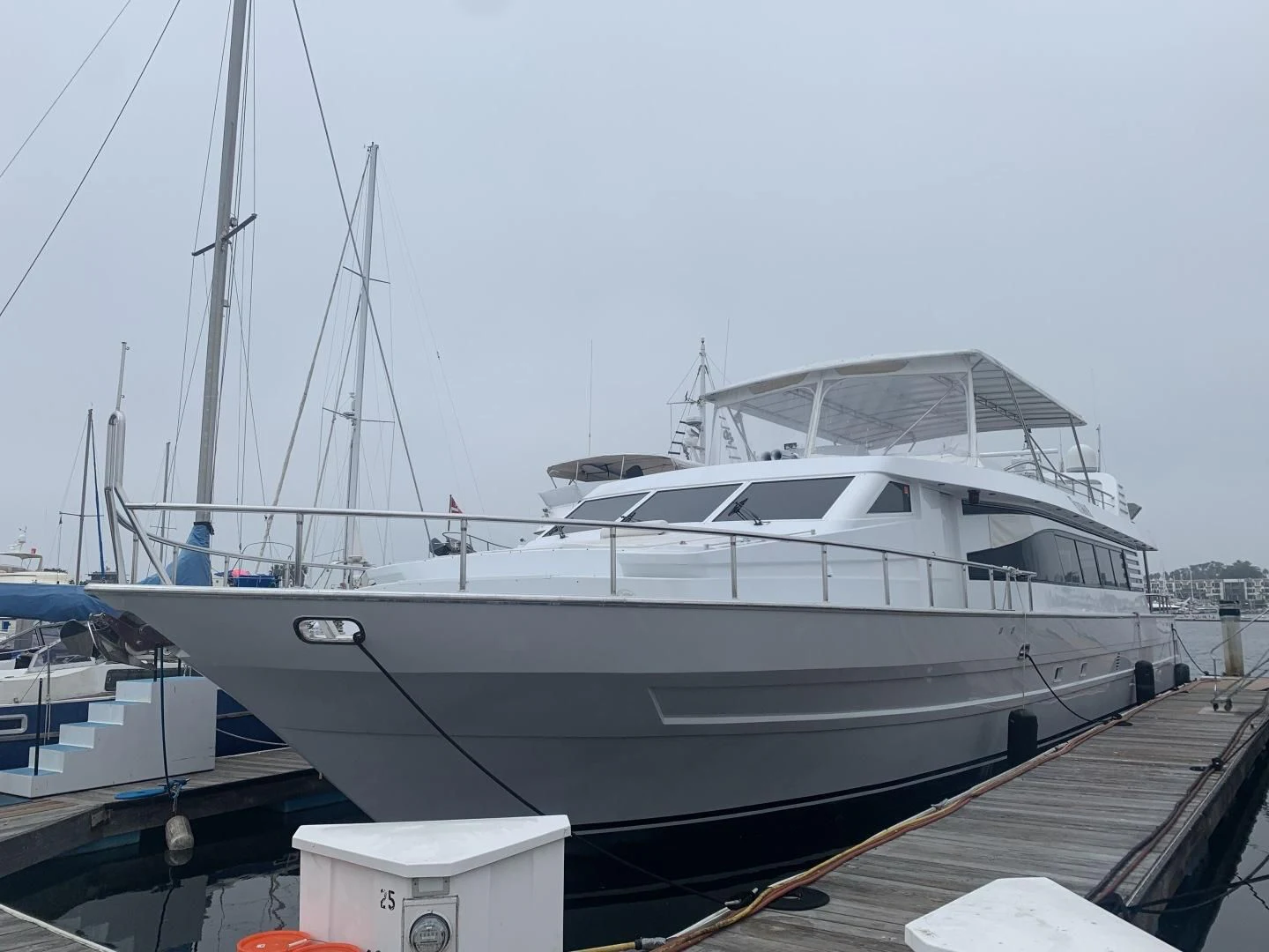 a boat docked at a pier aboard REHAB Yacht for Sale