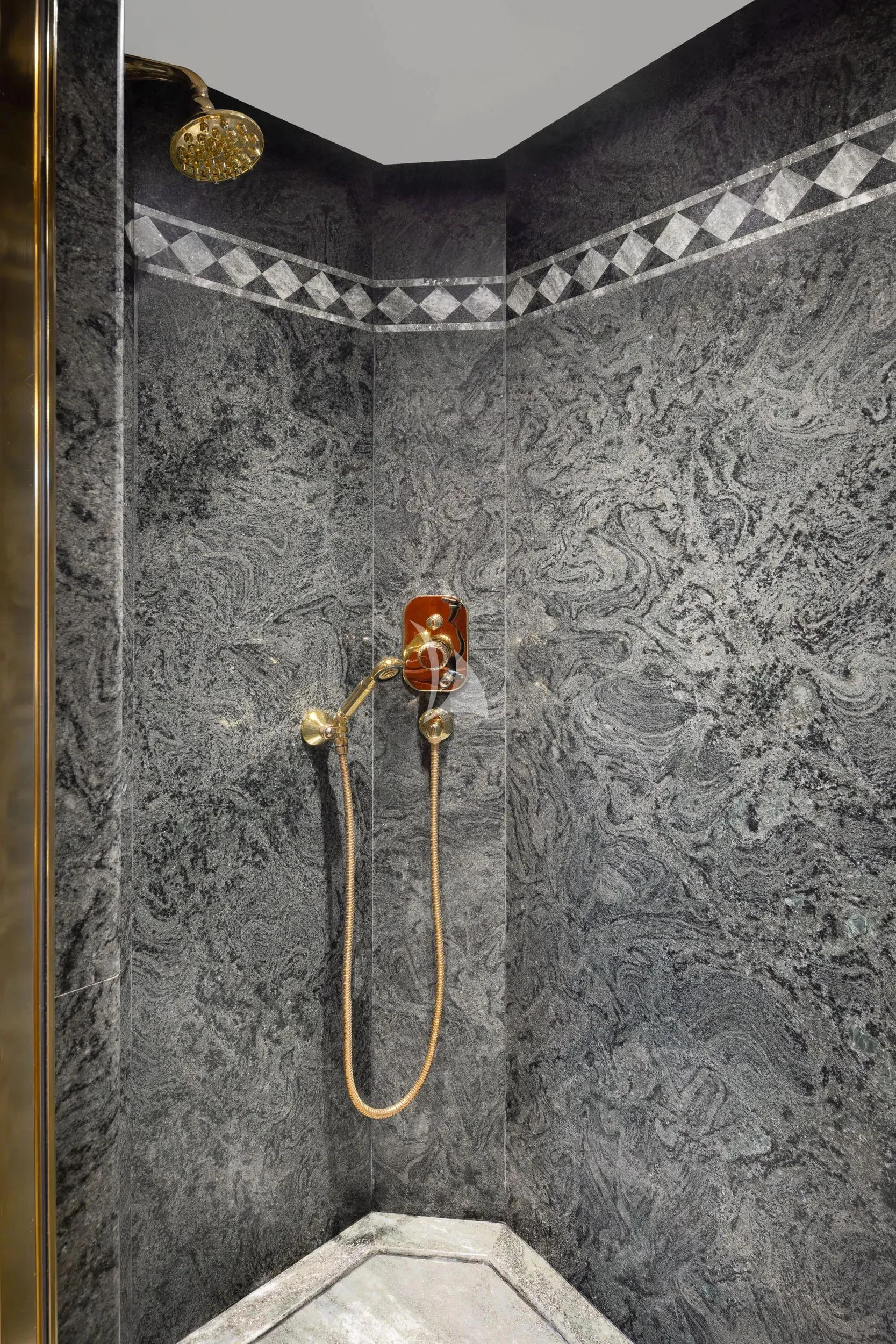 a couple of gold earrings from a hook aboard AKIRA ONE Yacht for Charter