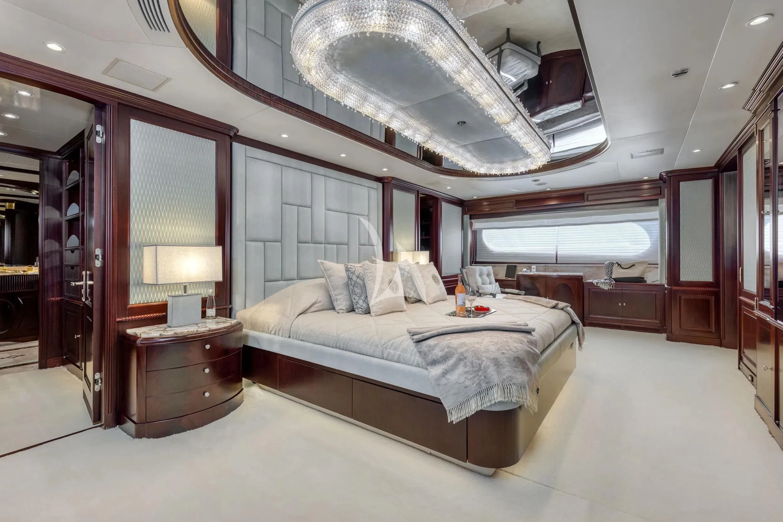 a large bedroom with a large bed aboard AKIRA ONE Yacht for Charter