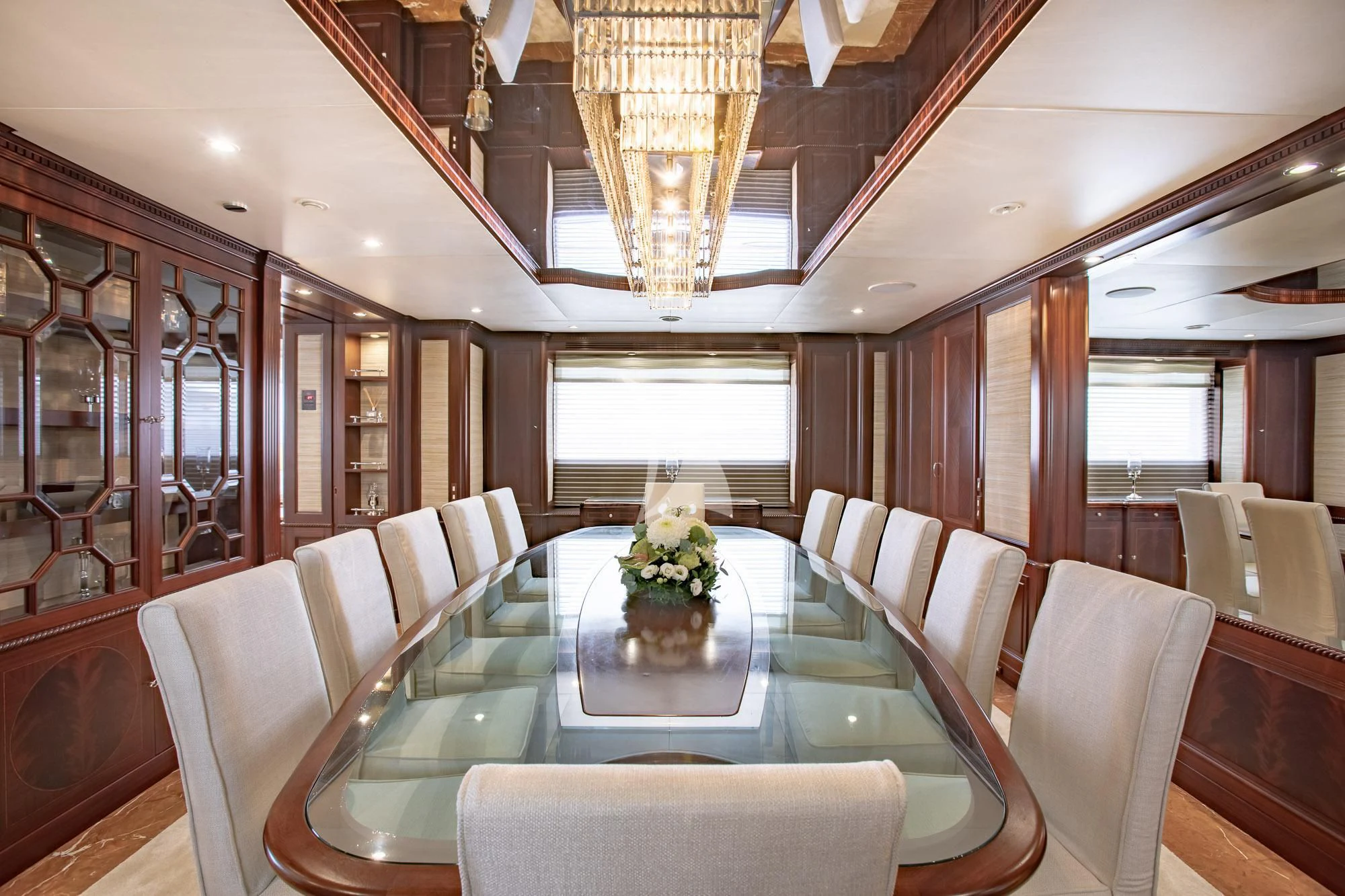 a large dining room with a table aboard AKIRA ONE Yacht for Charter