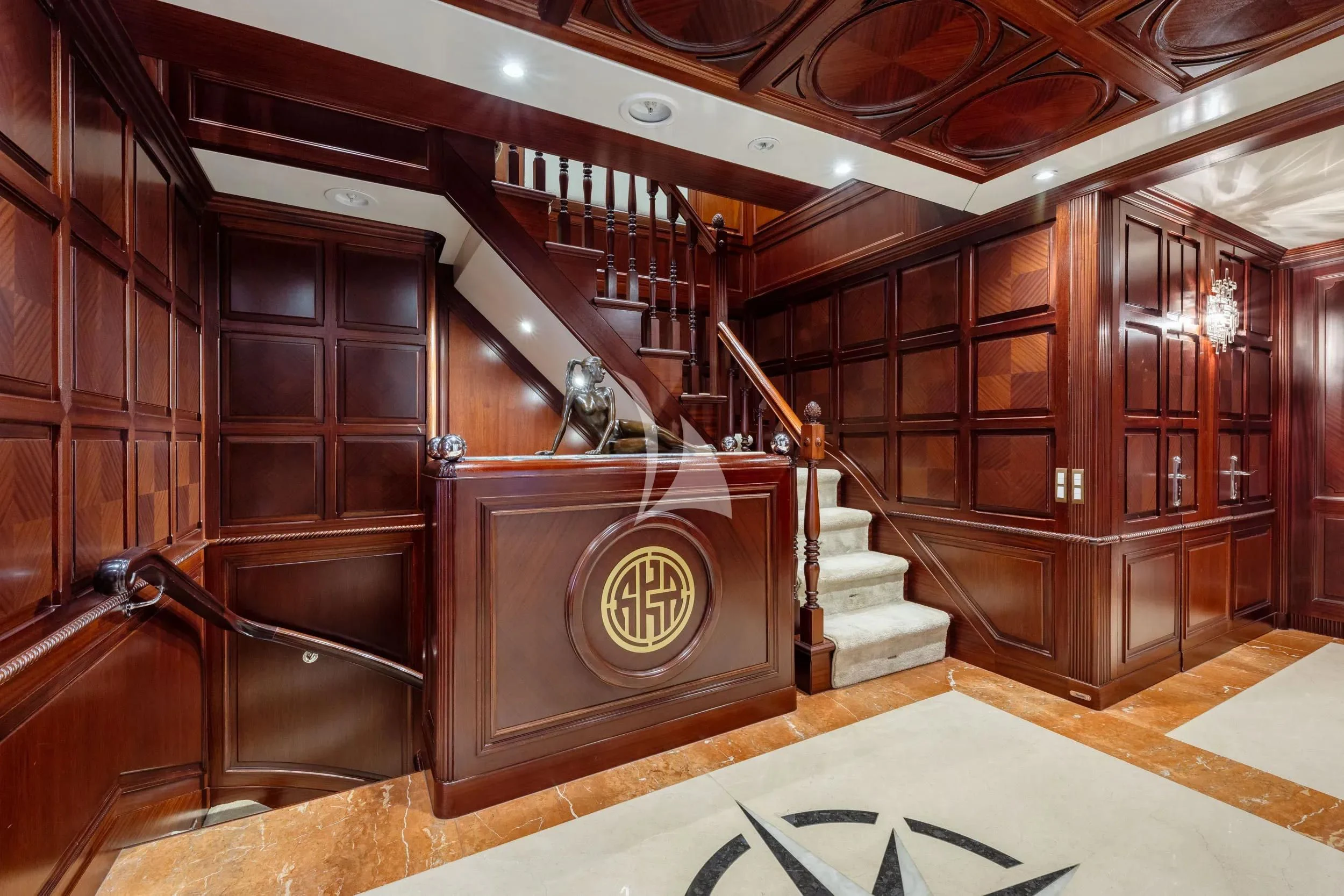 a room with wooden cabinets aboard AKIRA ONE Yacht for Charter