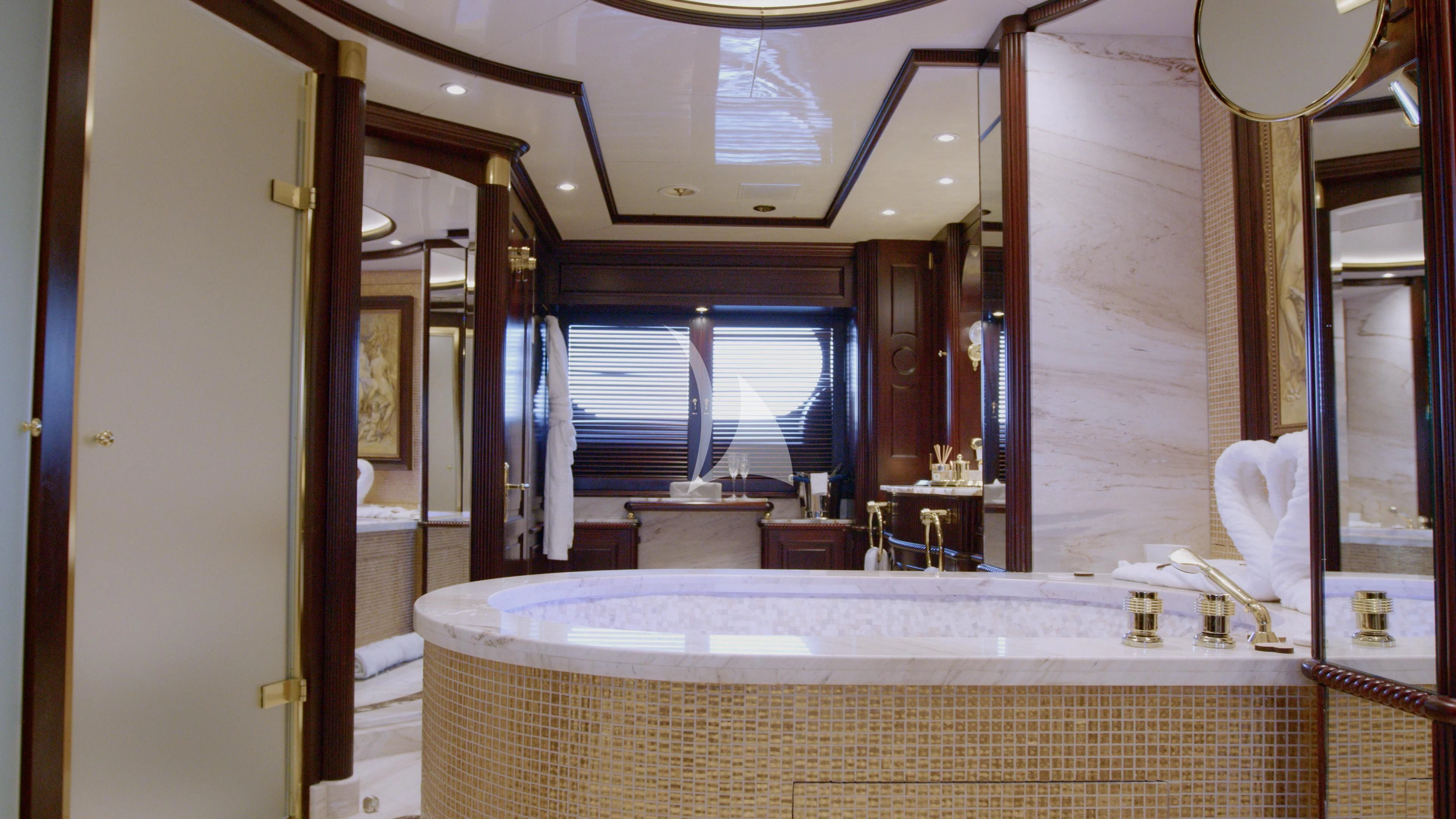 a room with a large white bathtub and a large window aboard AKIRA ONE Yacht for Charter