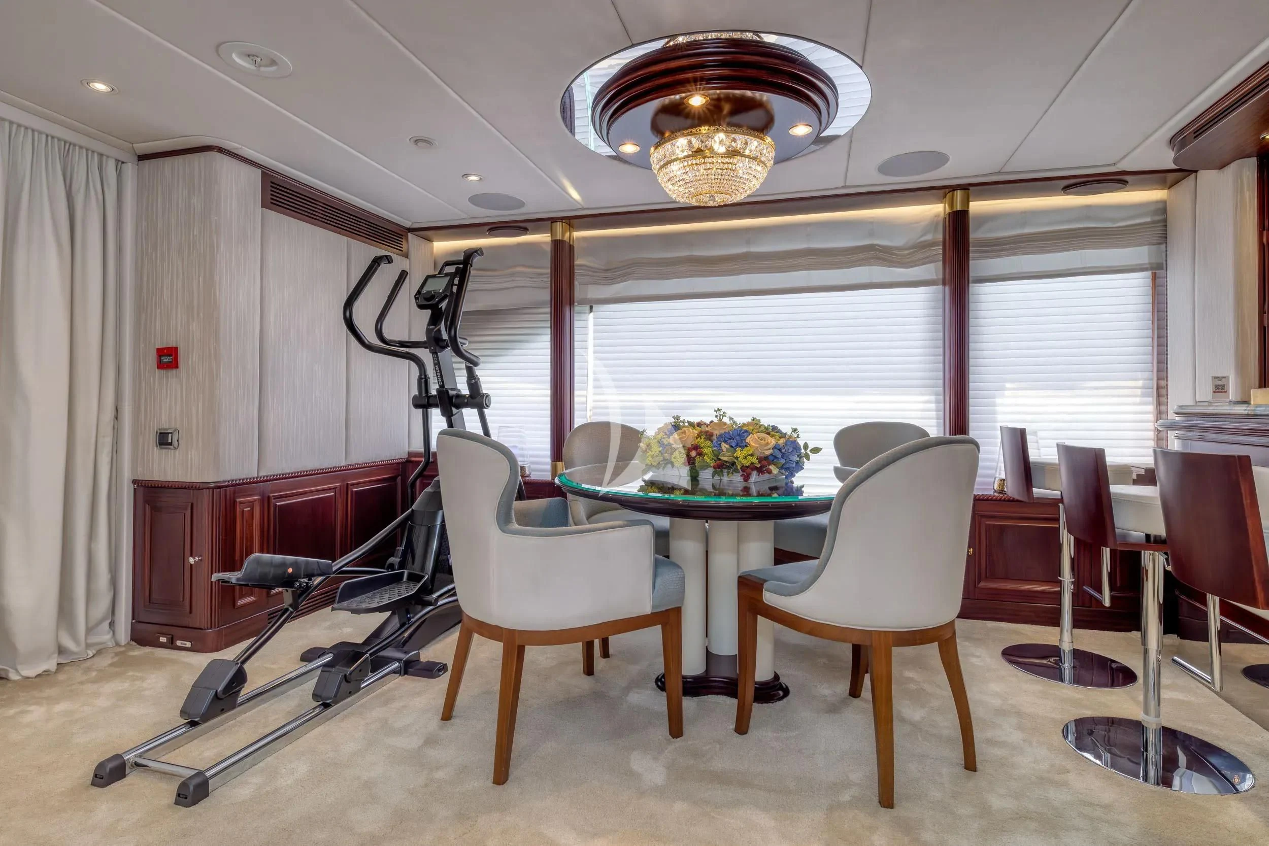 a room with a table and chairs aboard AKIRA ONE Yacht for Charter