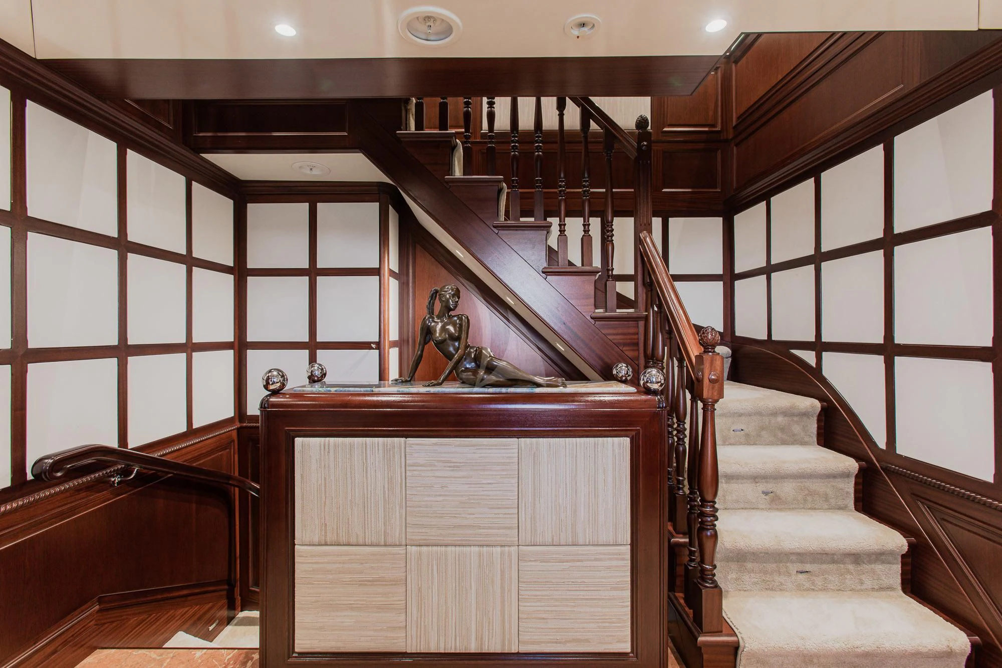 a wooden staircase in a building aboard AKIRA ONE Yacht for Charter