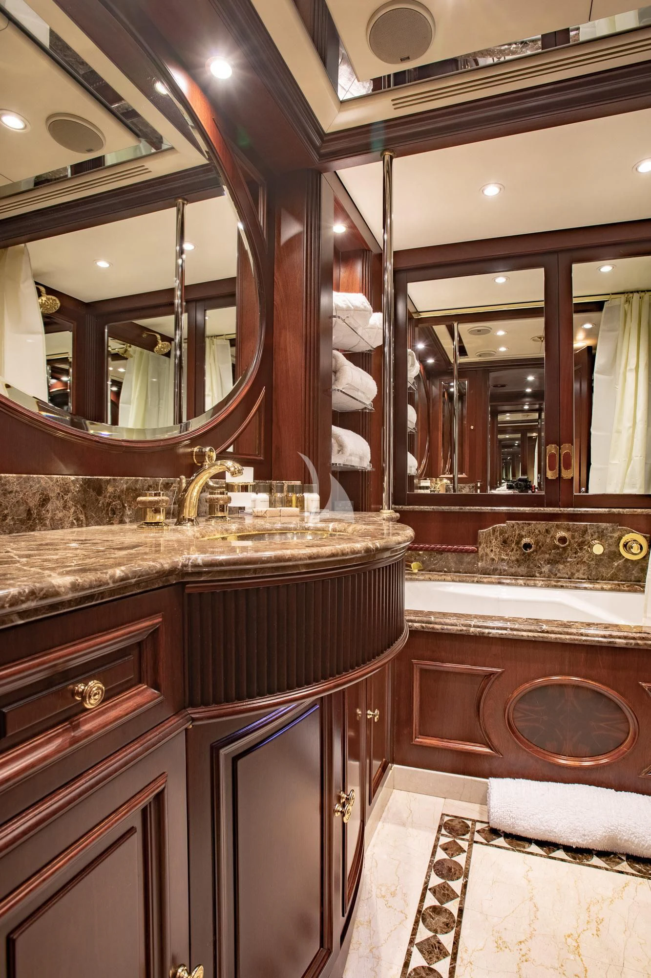 a bathroom with a large mirror aboard AKIRA ONE Yacht for Charter