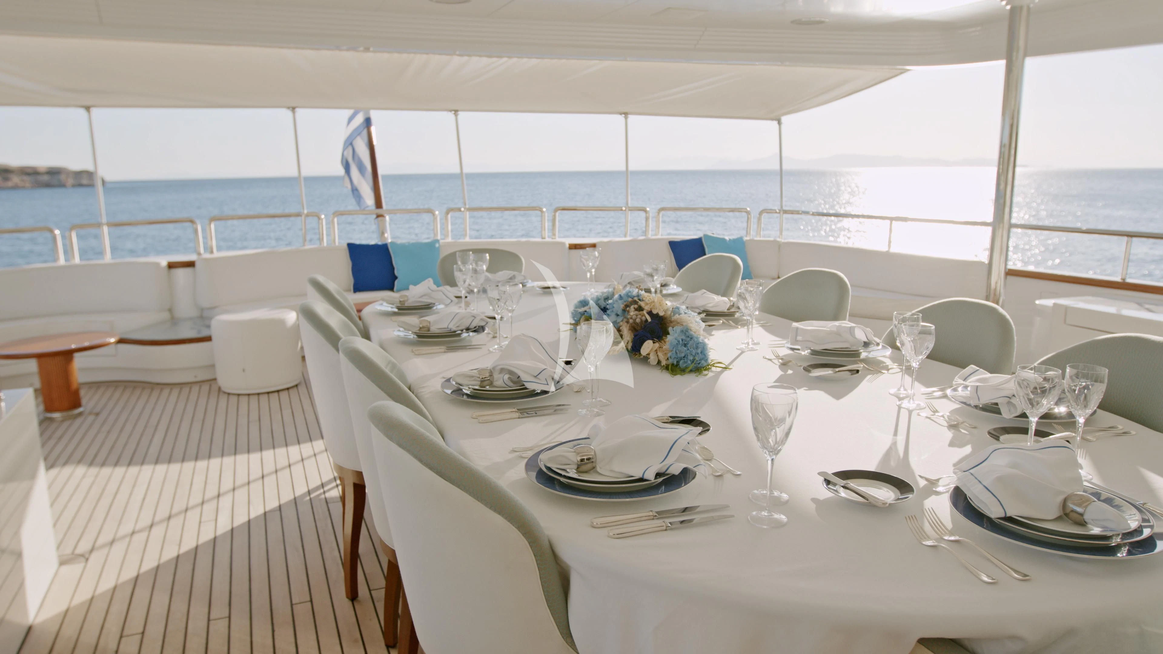 a table set for a dinner aboard AKIRA ONE Yacht for Charter