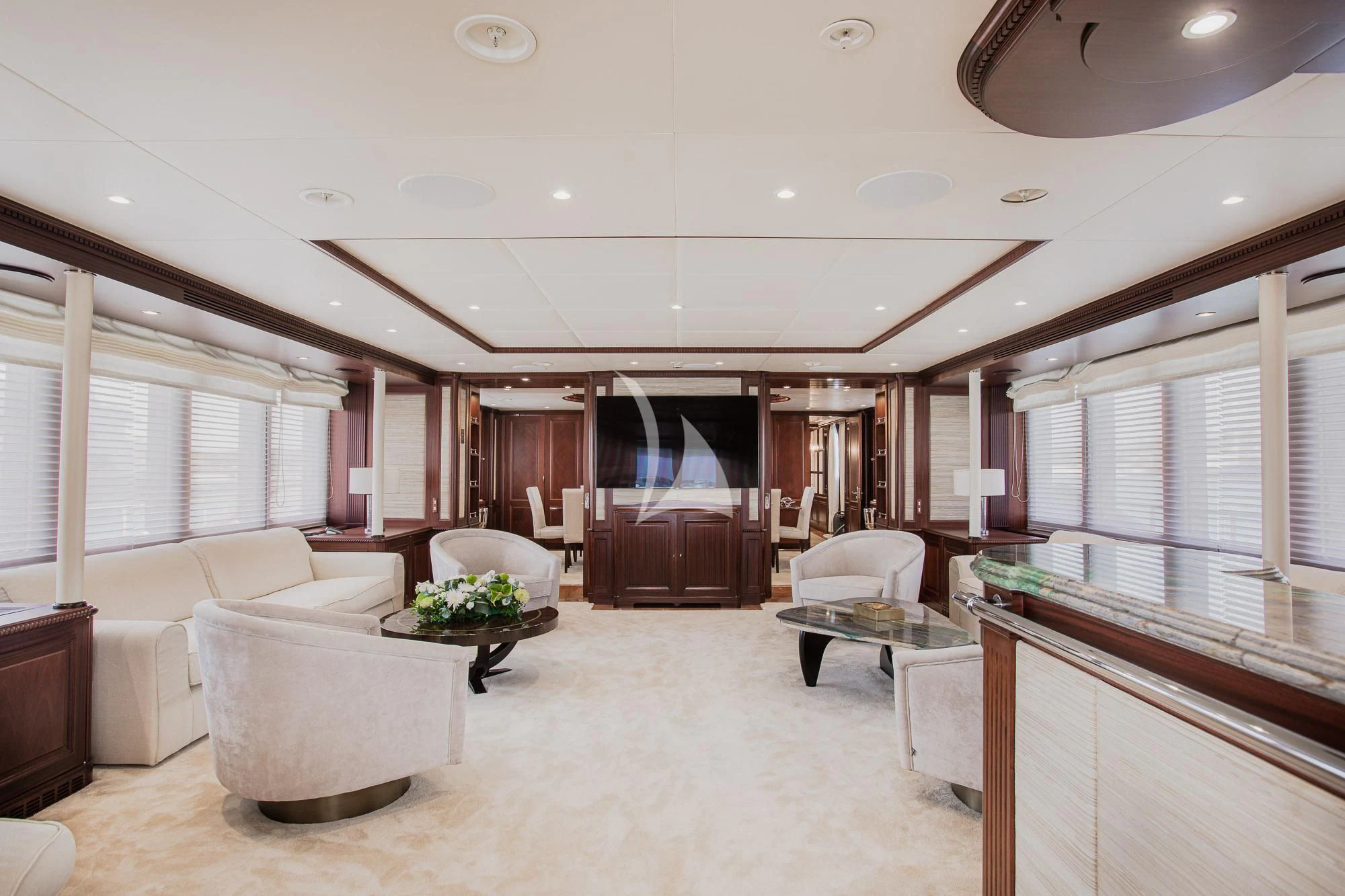 a living room with a large mirror aboard AKIRA ONE Yacht for Charter