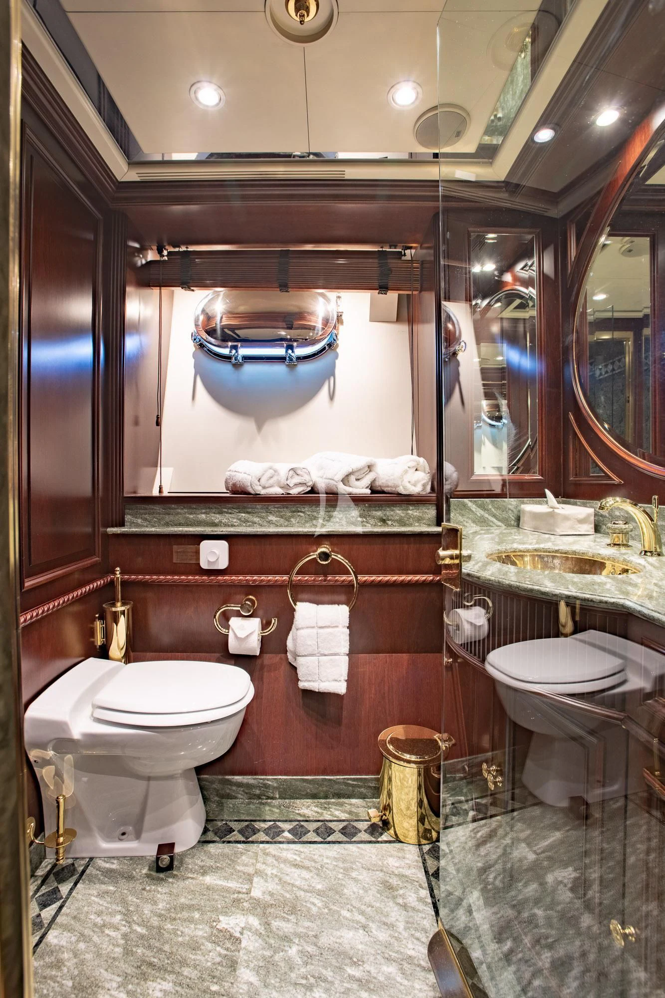 a bathroom with a large mirror aboard AKIRA ONE Yacht for Charter