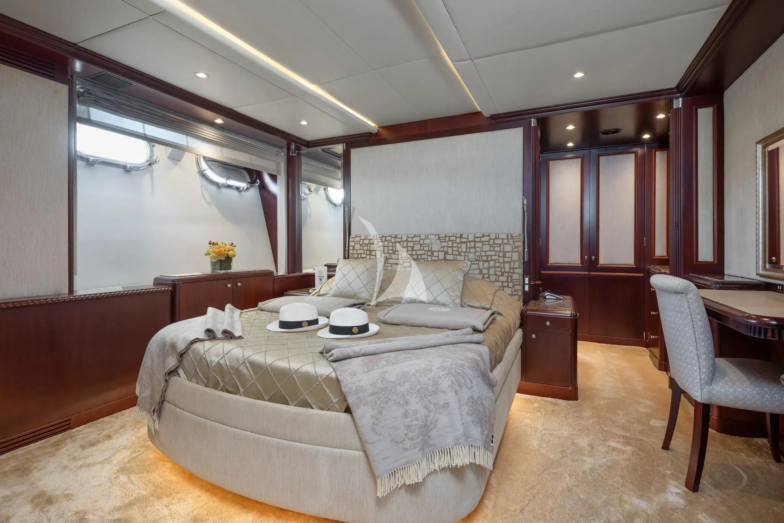 a large bedroom with a large bed aboard AKIRA ONE Yacht for Charter