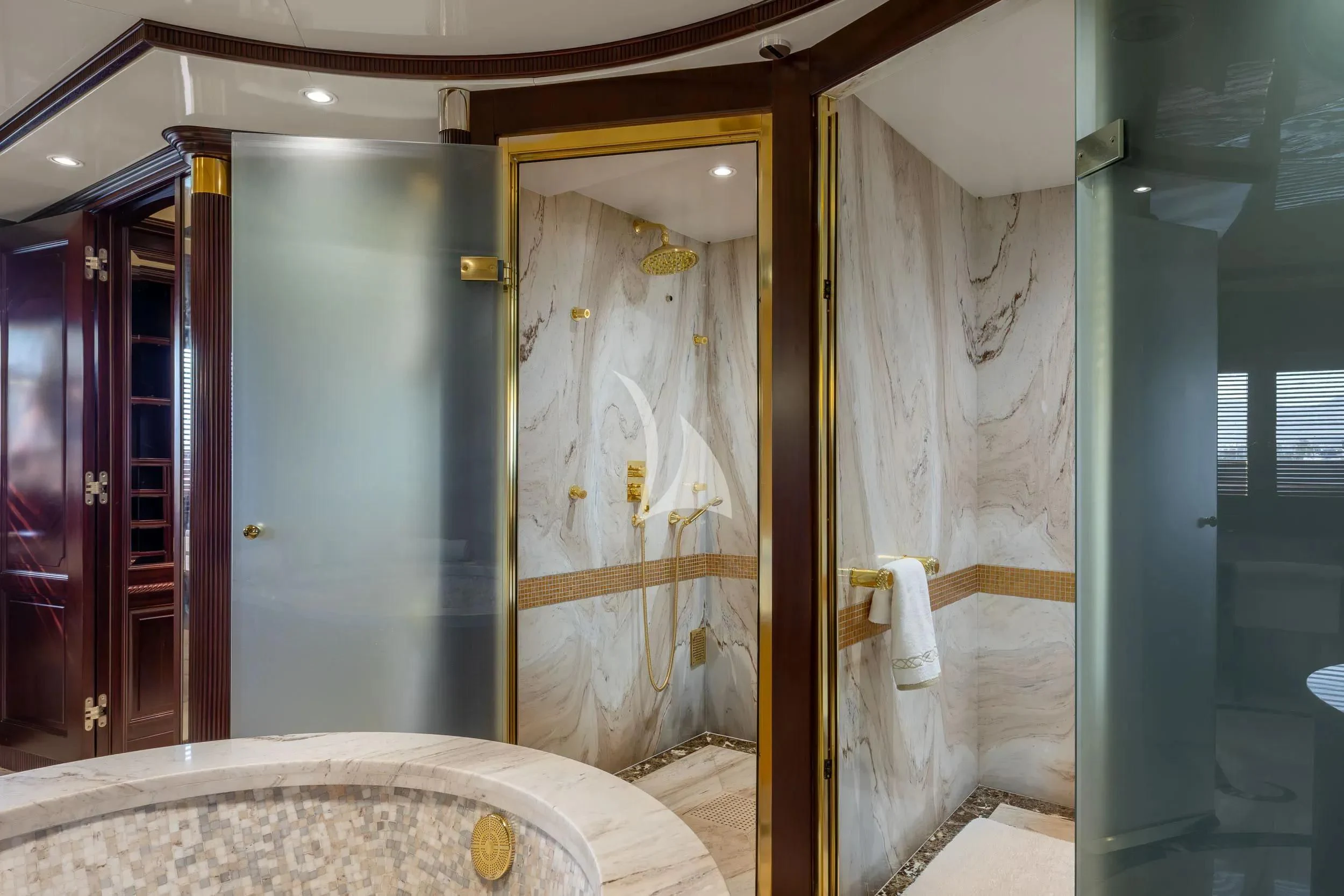 a bathroom with a tub and shower aboard AKIRA ONE Yacht for Charter