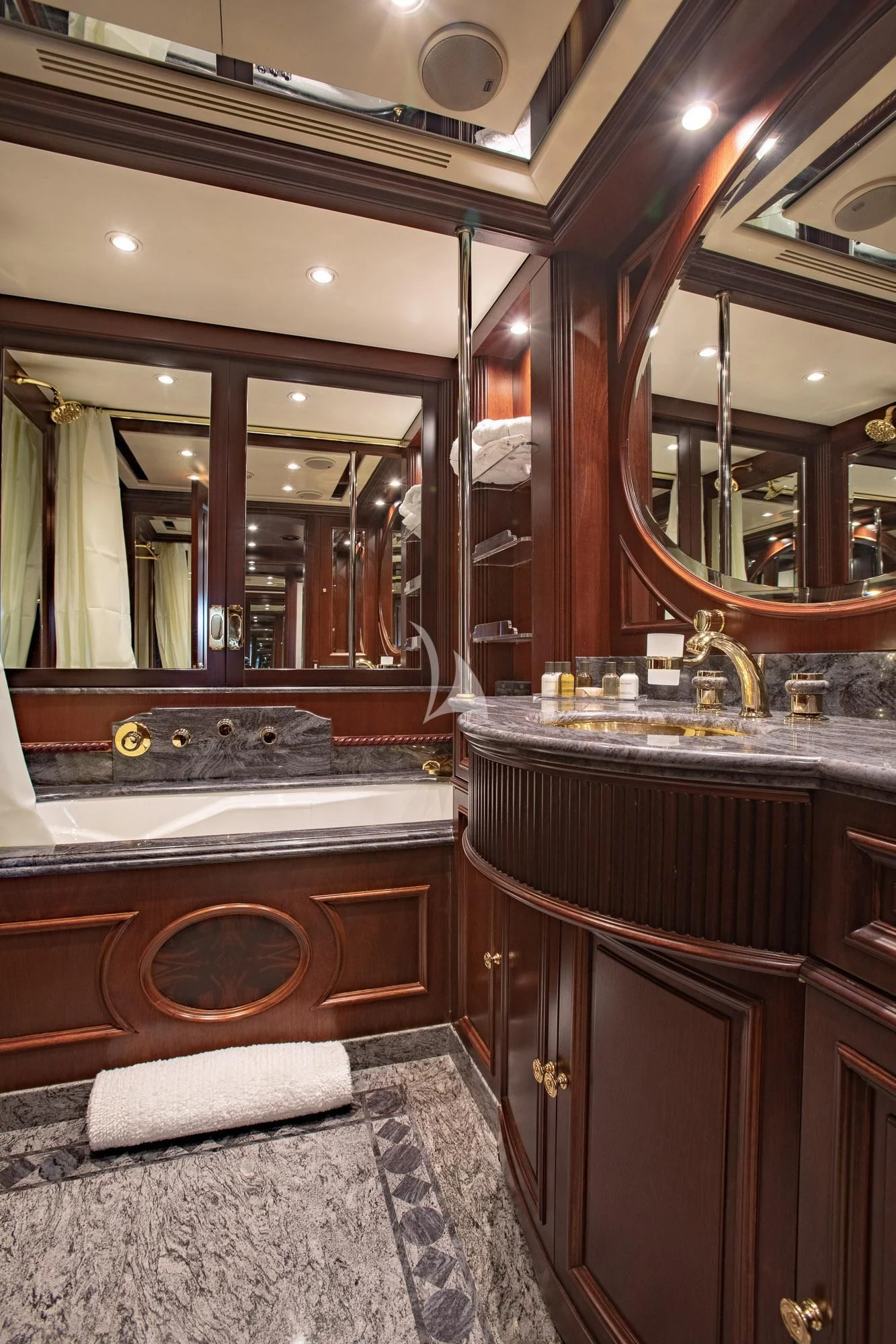 a bathroom with a large mirror aboard AKIRA ONE Yacht for Charter