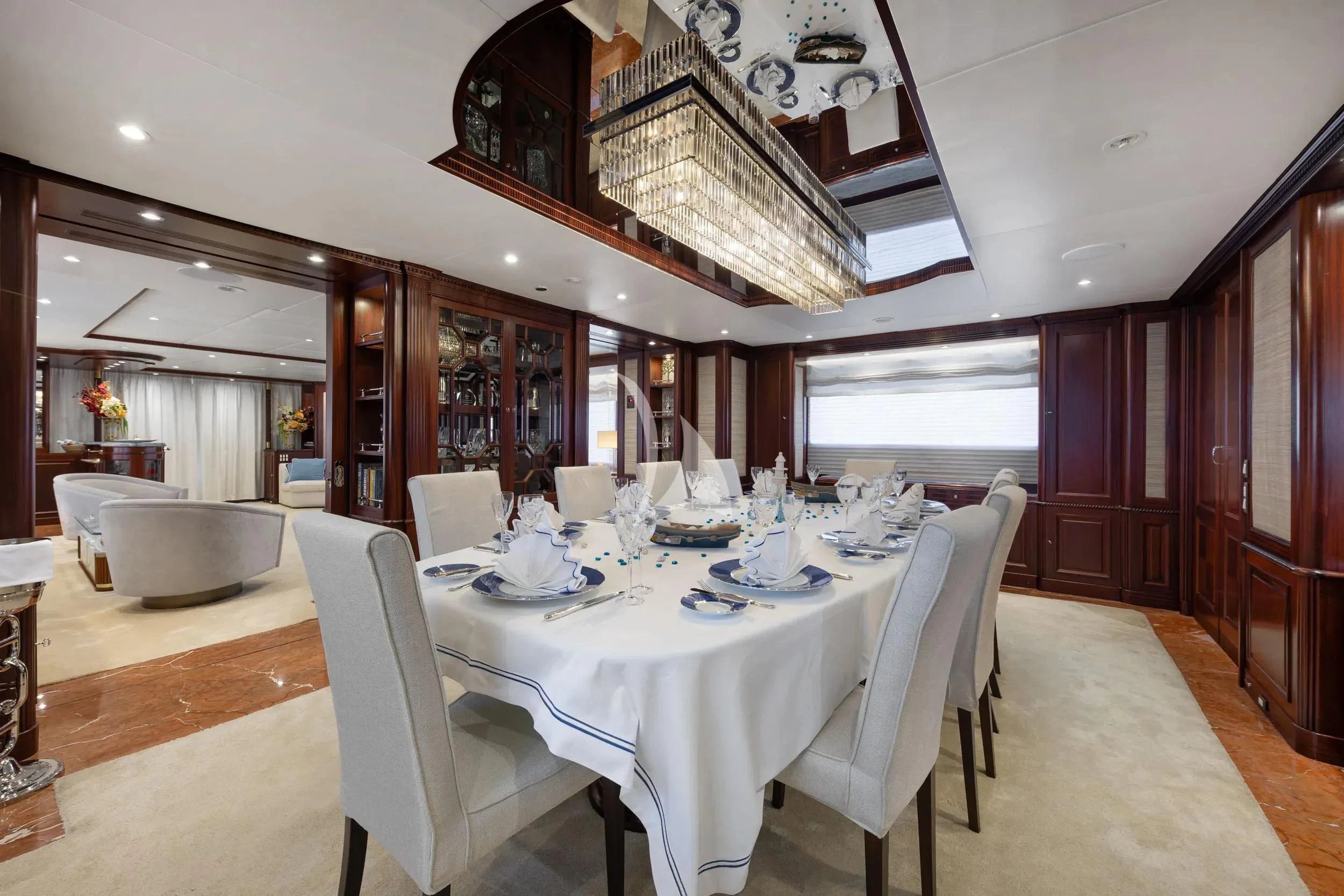 a dining room with a table set aboard AKIRA ONE Yacht for Charter