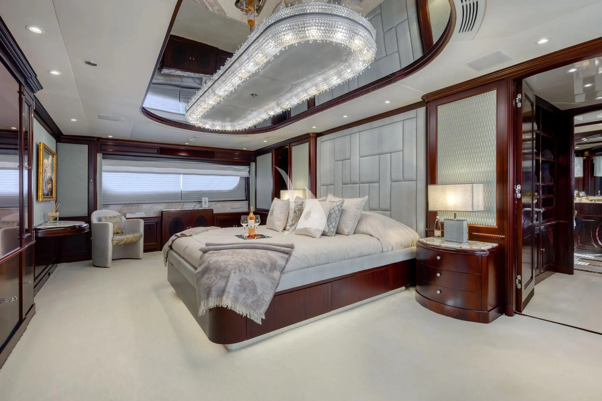 a large bedroom with a large bed aboard AKIRA ONE Yacht for Charter