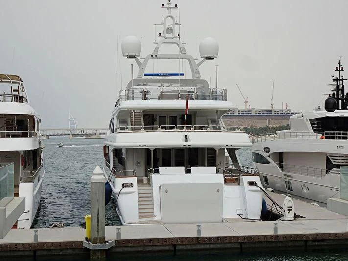 a boat docked at a pier aboard AKIRA ONE Yacht for Charter