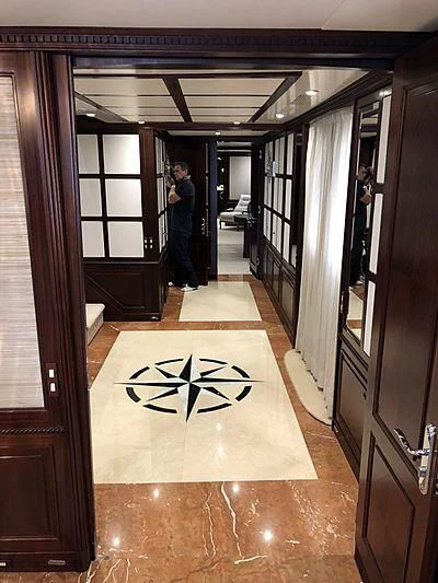 a person standing in a doorway aboard AKIRA ONE Yacht for Charter