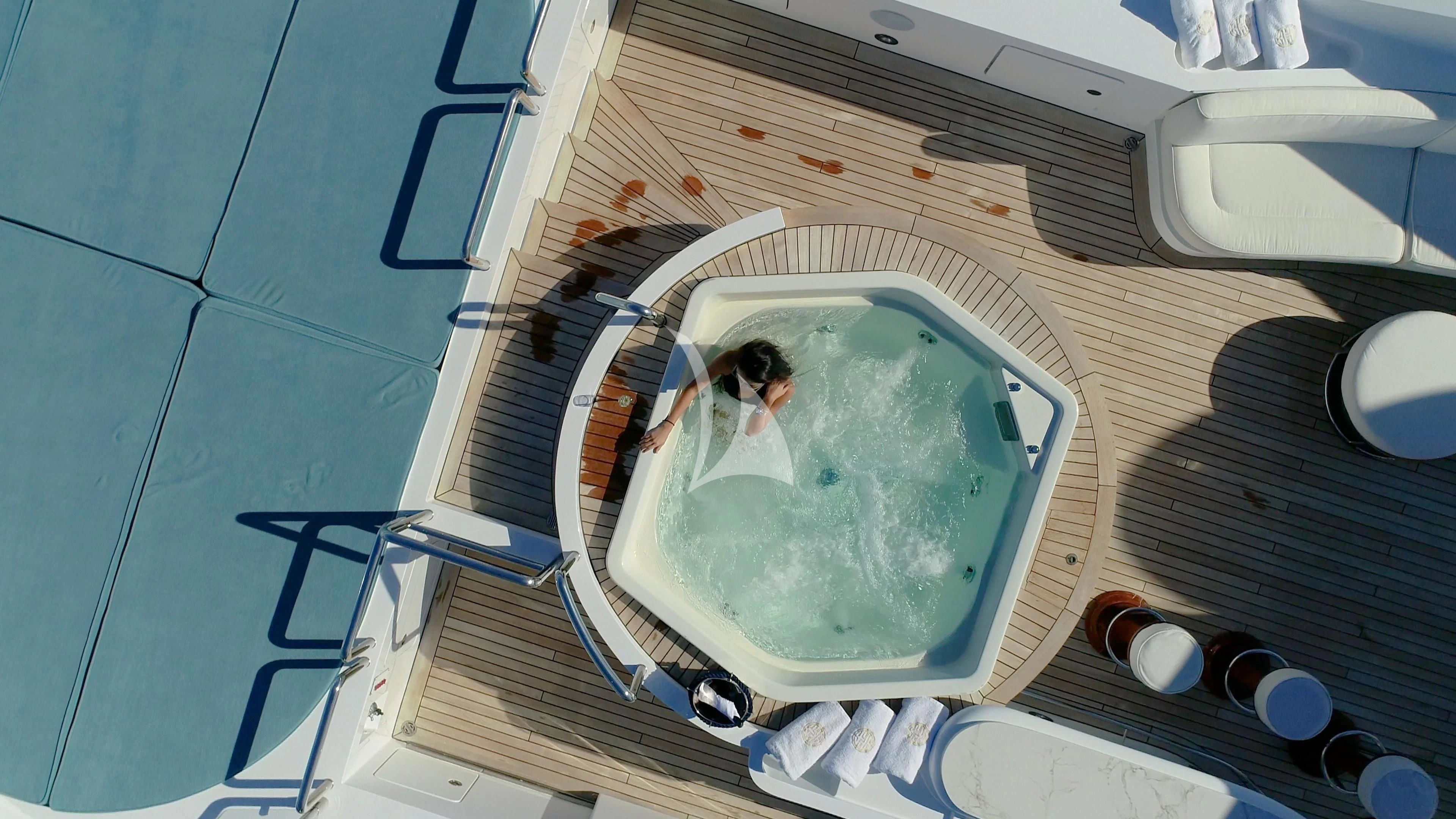 a broken window on a blue tiled floor aboard AKIRA ONE Yacht for Charter