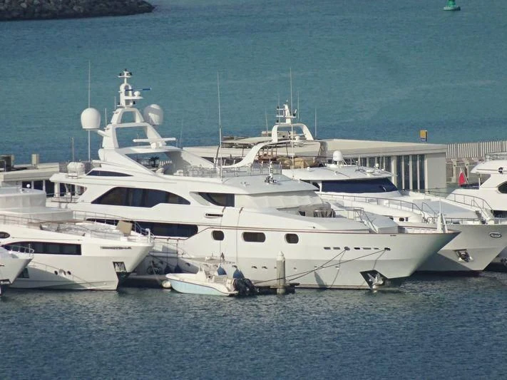a group of white yachts in the water aboard AKIRA ONE Yacht for Charter