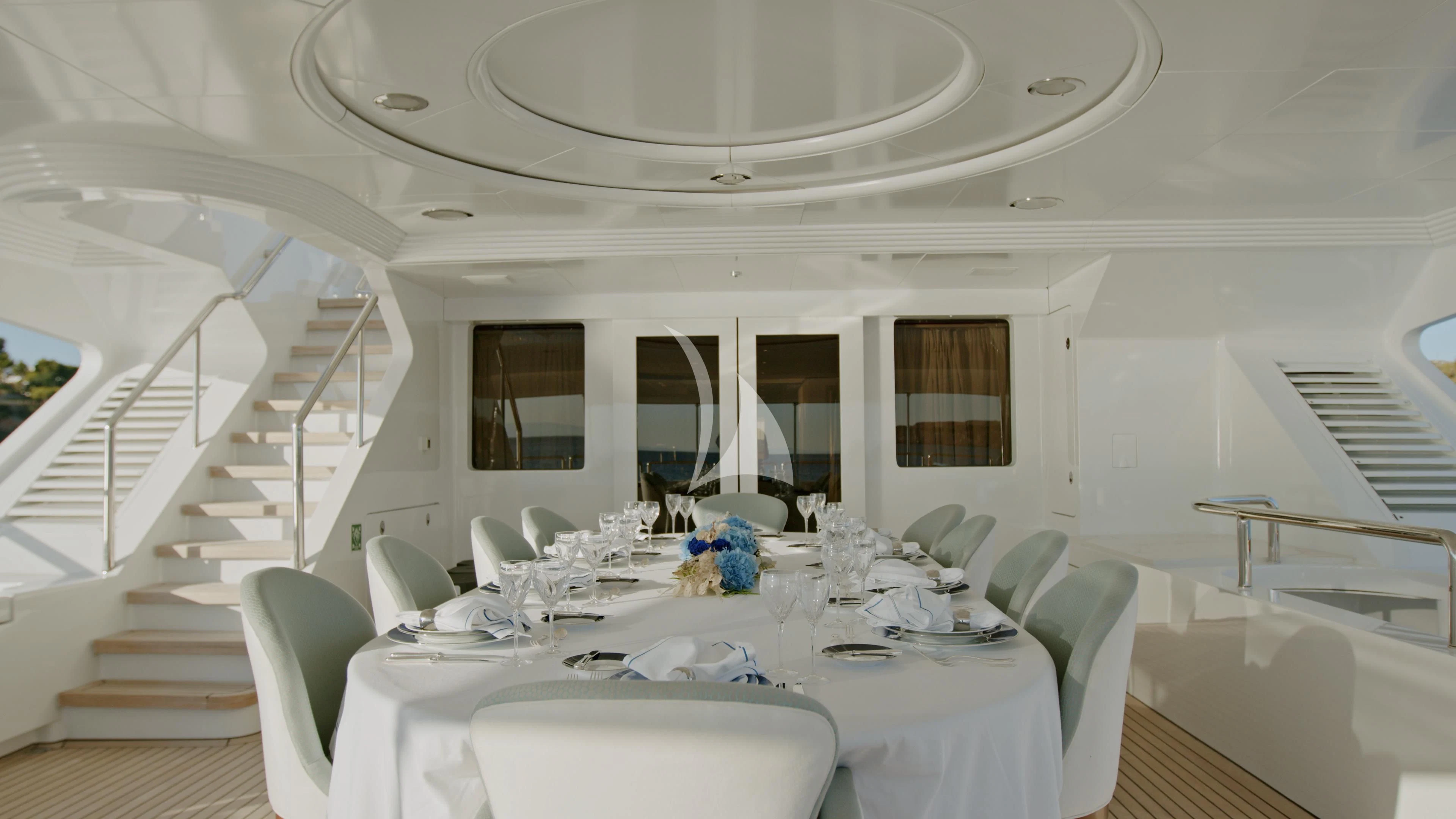 a dining room with a large table aboard AKIRA ONE Yacht for Charter