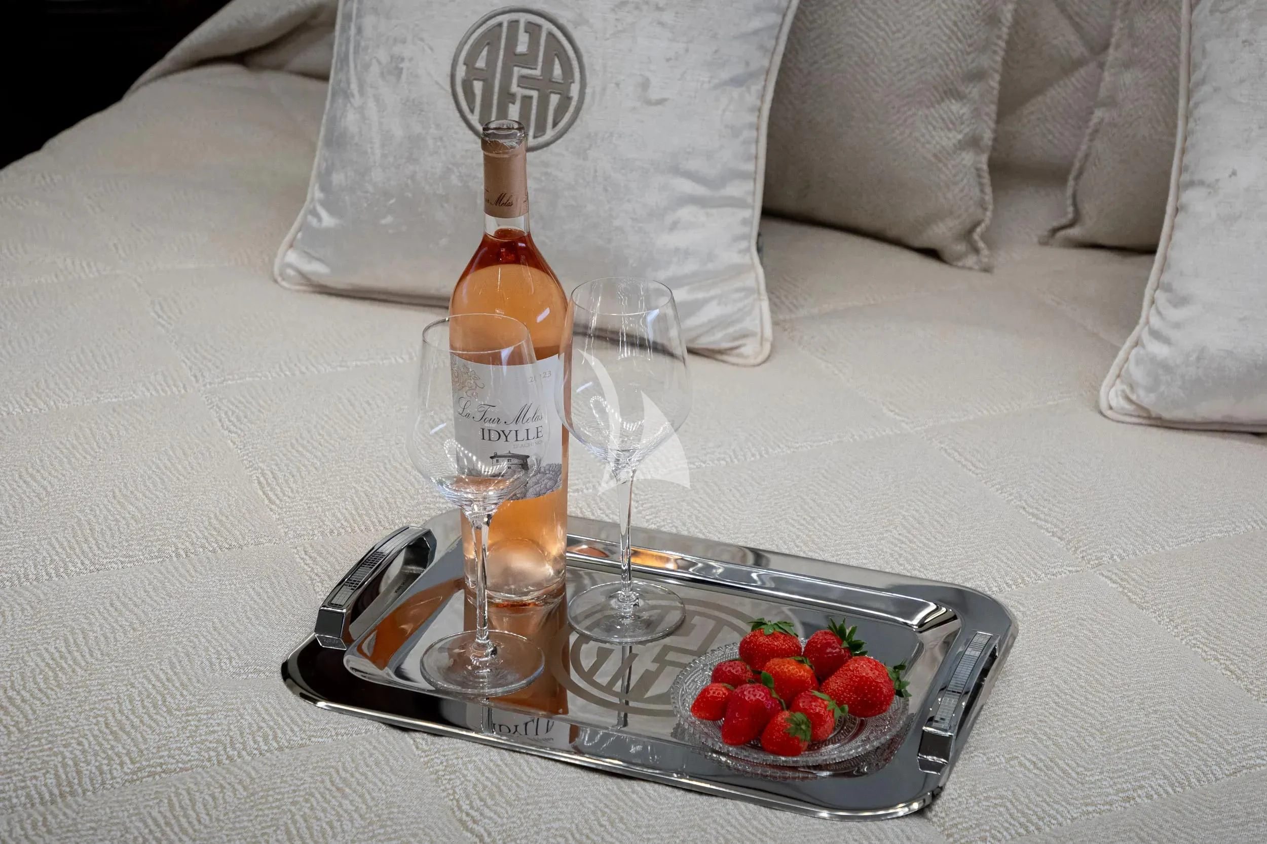 a bottle of liquor on a tray aboard AKIRA ONE Yacht for Charter