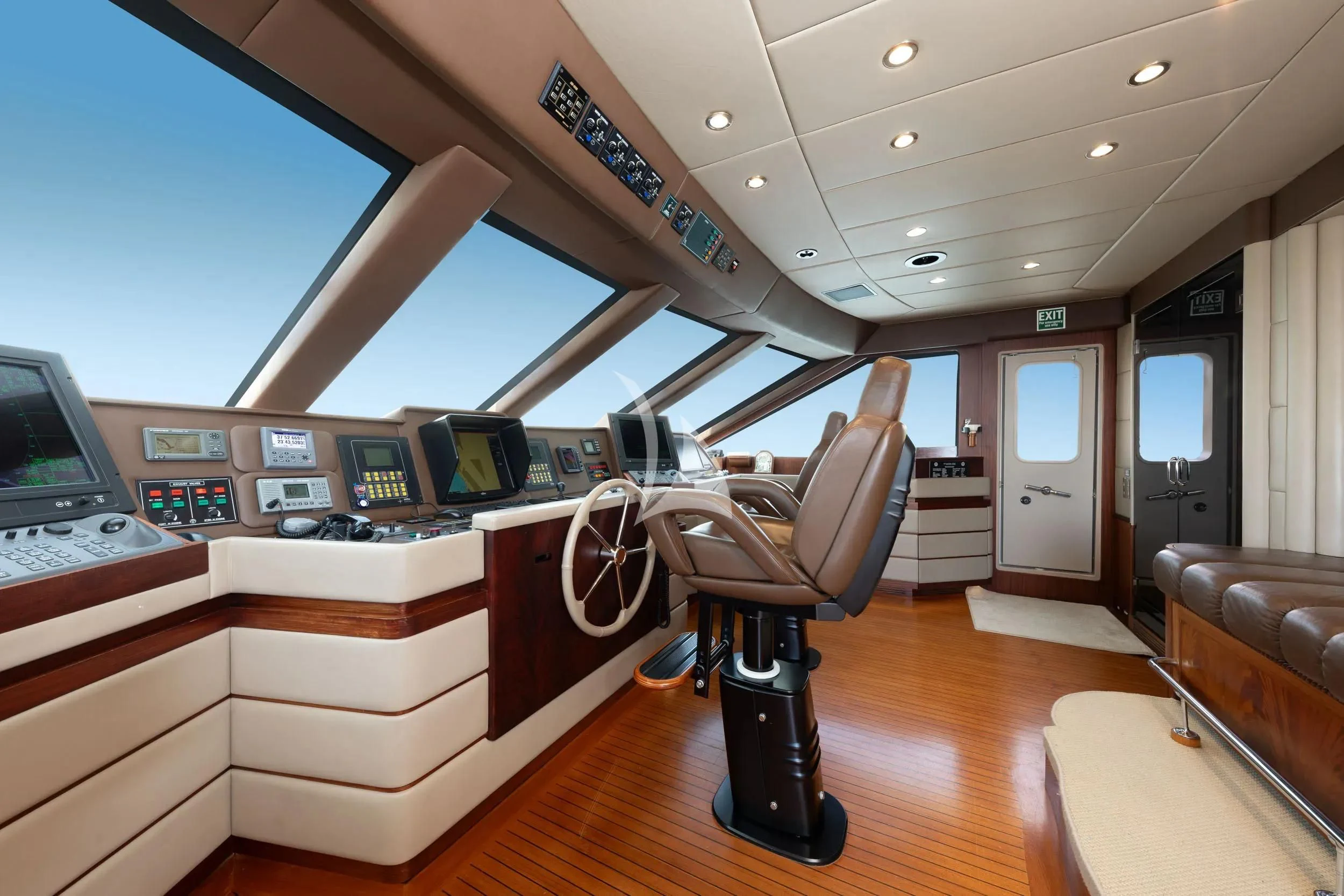 a room with a desk and chairs aboard AKIRA ONE Yacht for Charter