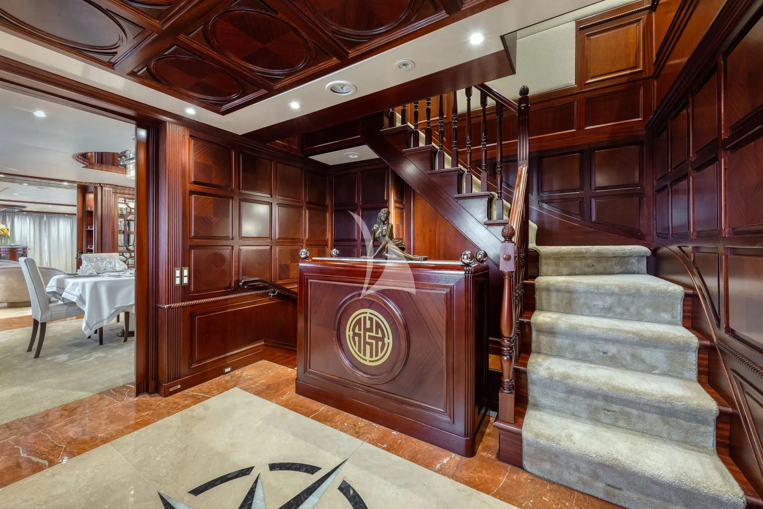 a staircase in a building aboard AKIRA ONE Yacht for Charter