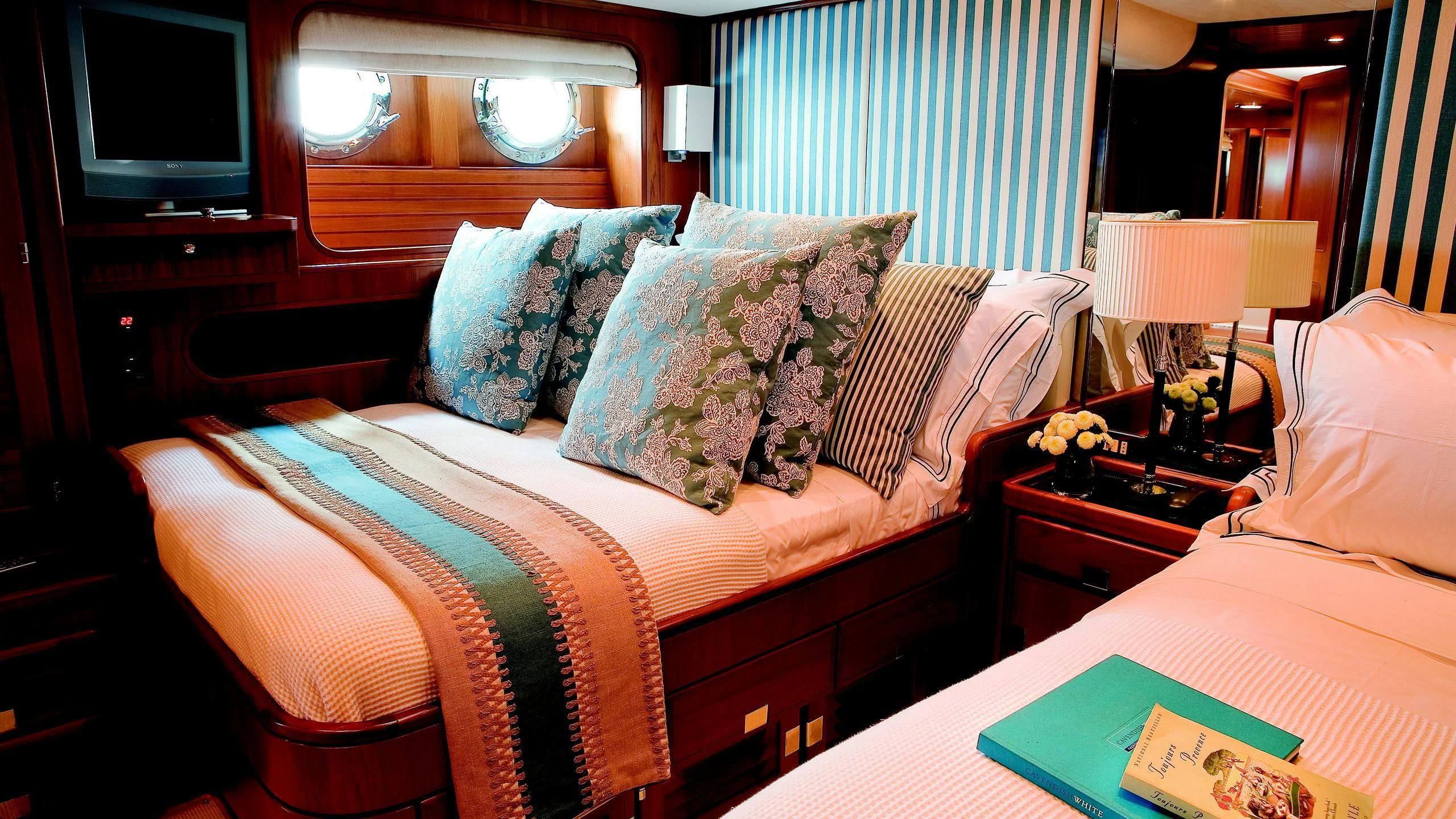 a couple of beds in a hotel room aboard GITANA Yacht for Charter