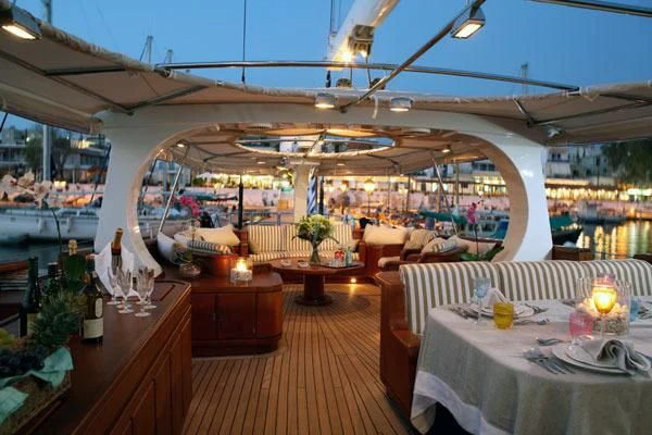 a restaurant with tables and chairs aboard GITANA Yacht for Charter
