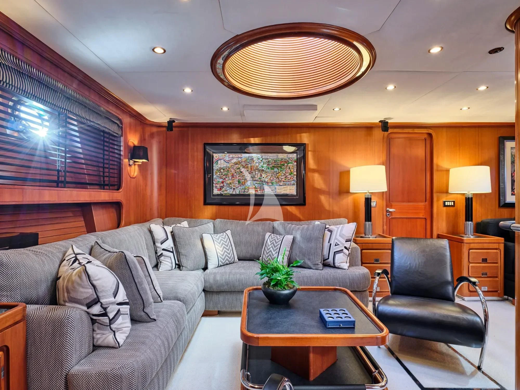 a living room with a couch and a coffee table aboard GITANA Yacht for Charter