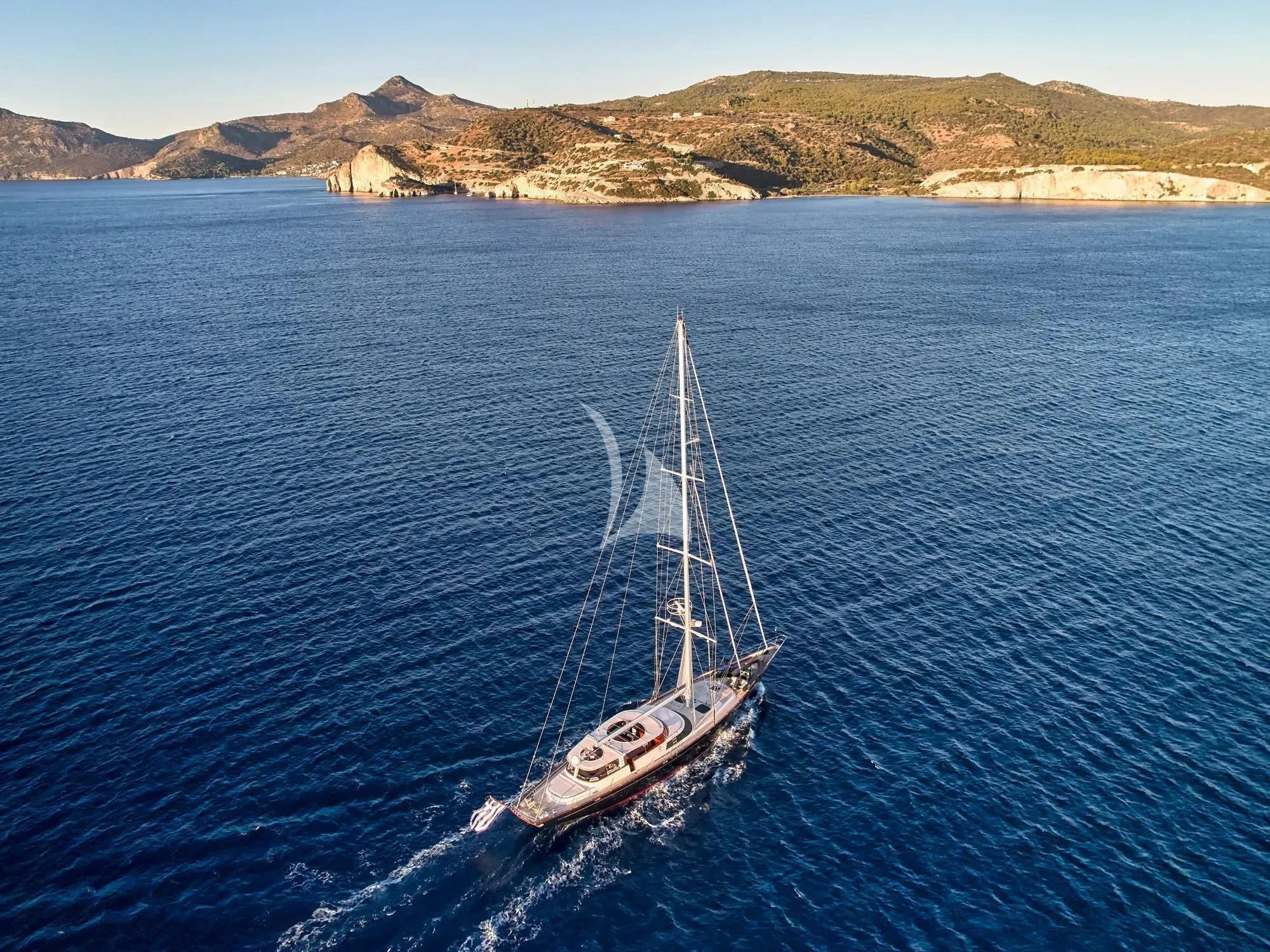 a boat sailing on the water aboard GITANA Yacht for Charter