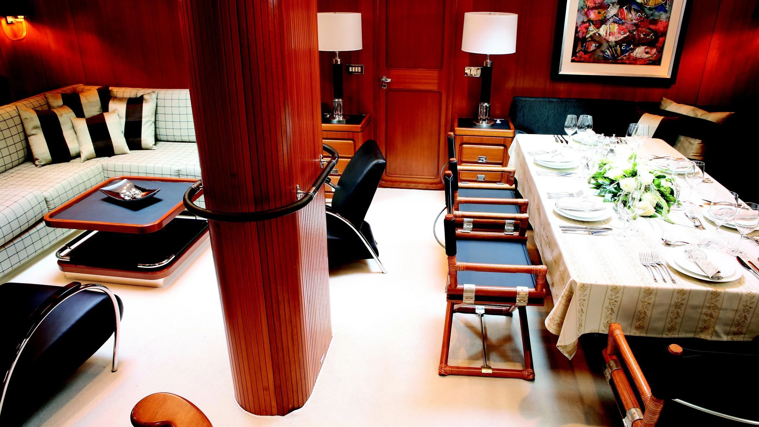a room with a table and chairs aboard GITANA Yacht for Charter
