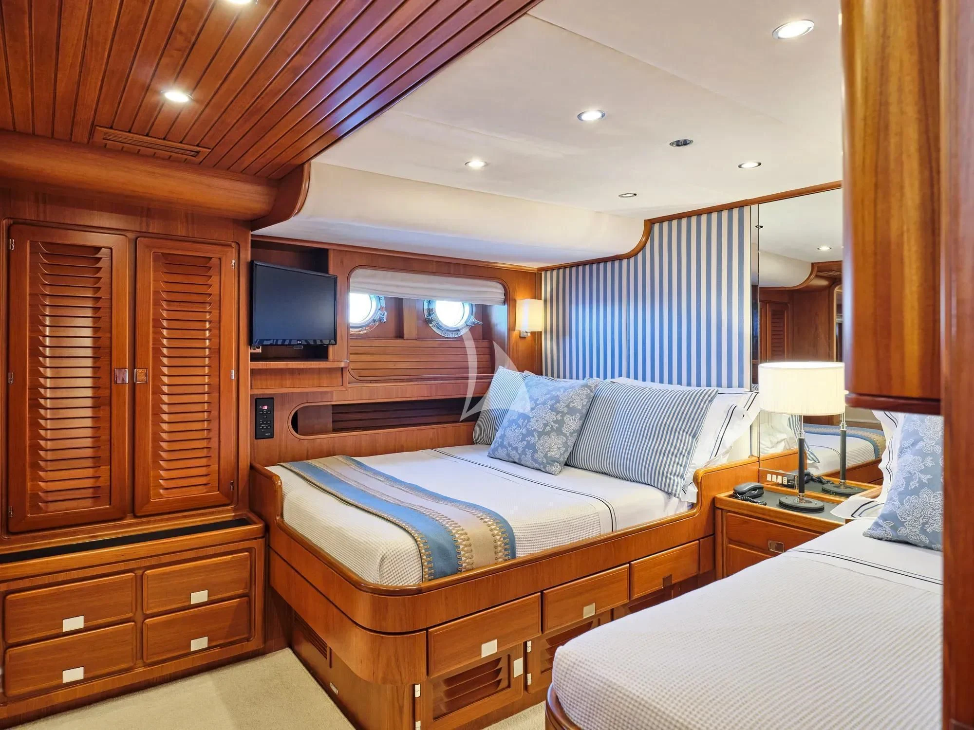 a bedroom with two beds aboard GITANA Yacht for Charter
